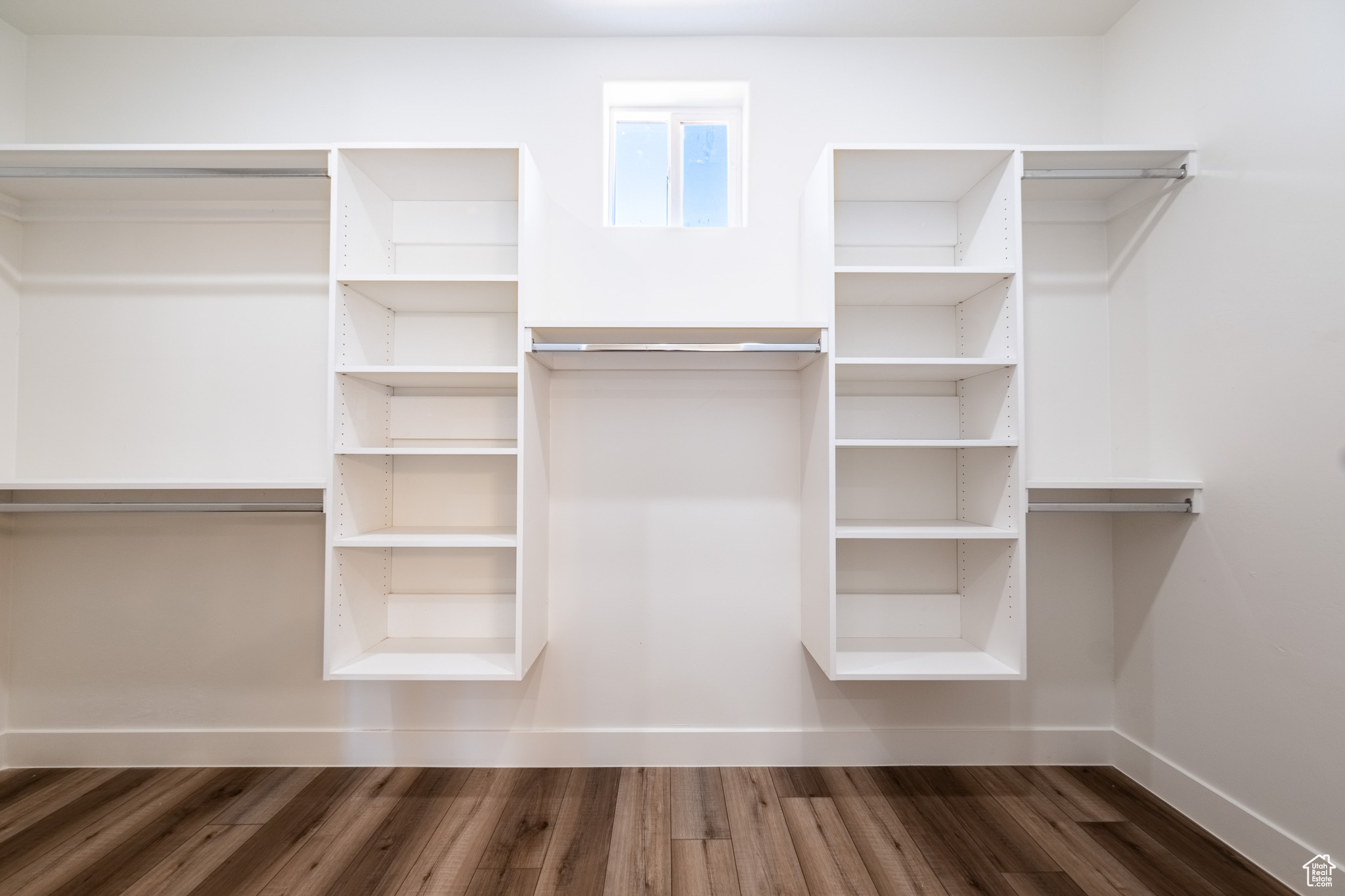 Walk in closet featuring wood finished floors