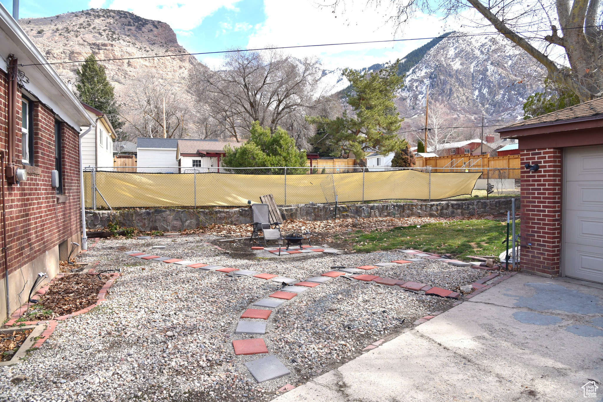 View of back yard featuring a mountain view, a patio area, and fence