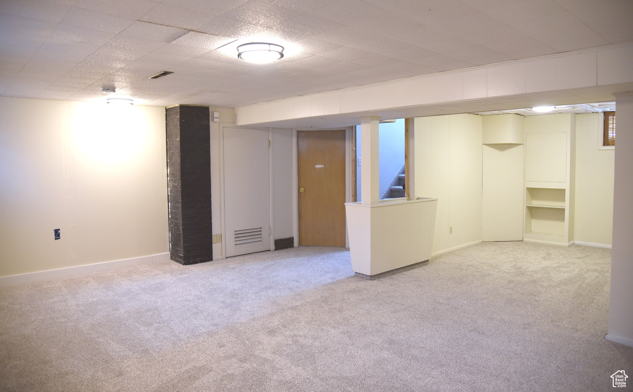 View of basement family room and den/office area.
