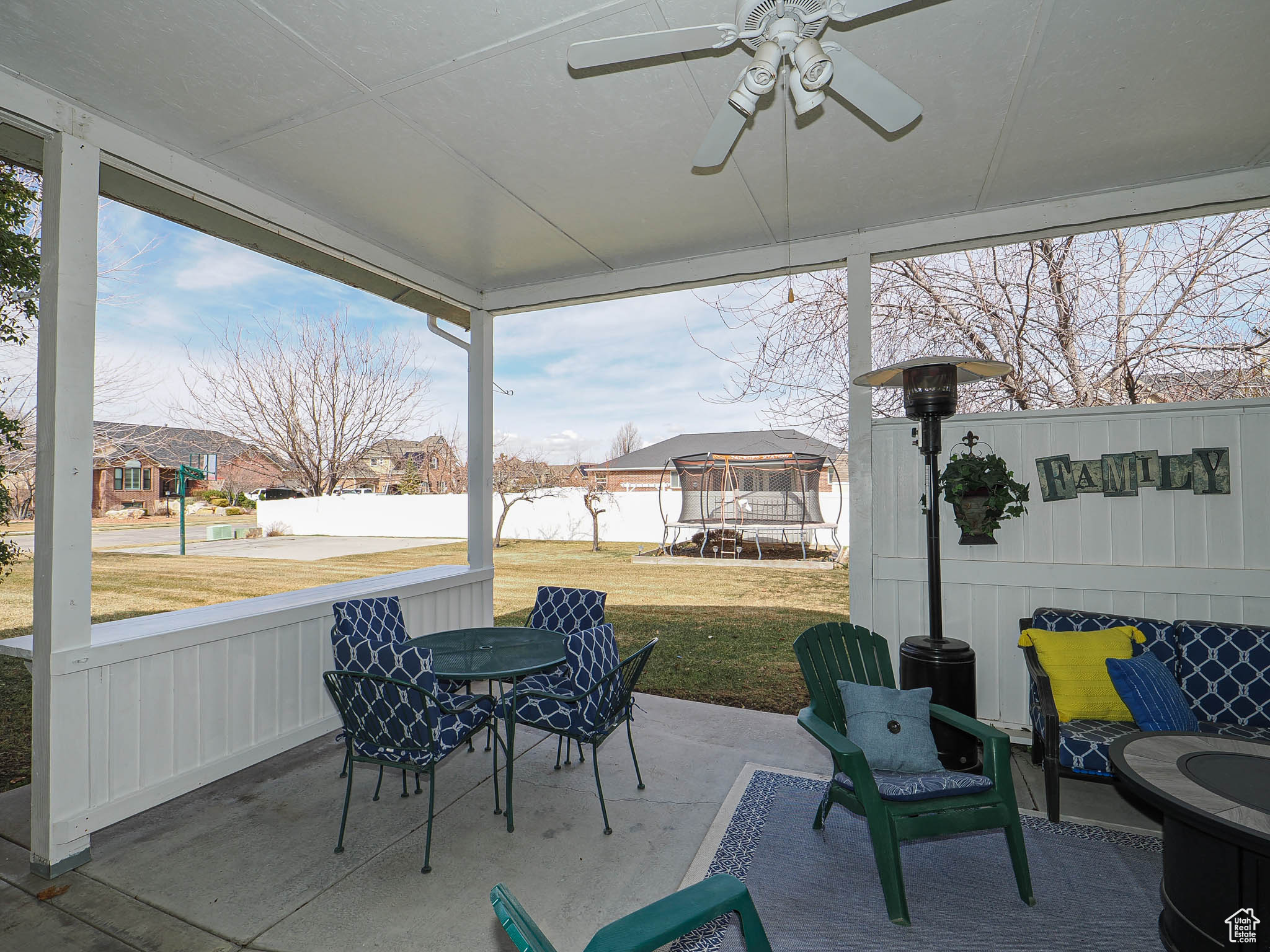 View of patio / terrace with outdoor dining area, a trampoline, and ceiling fan