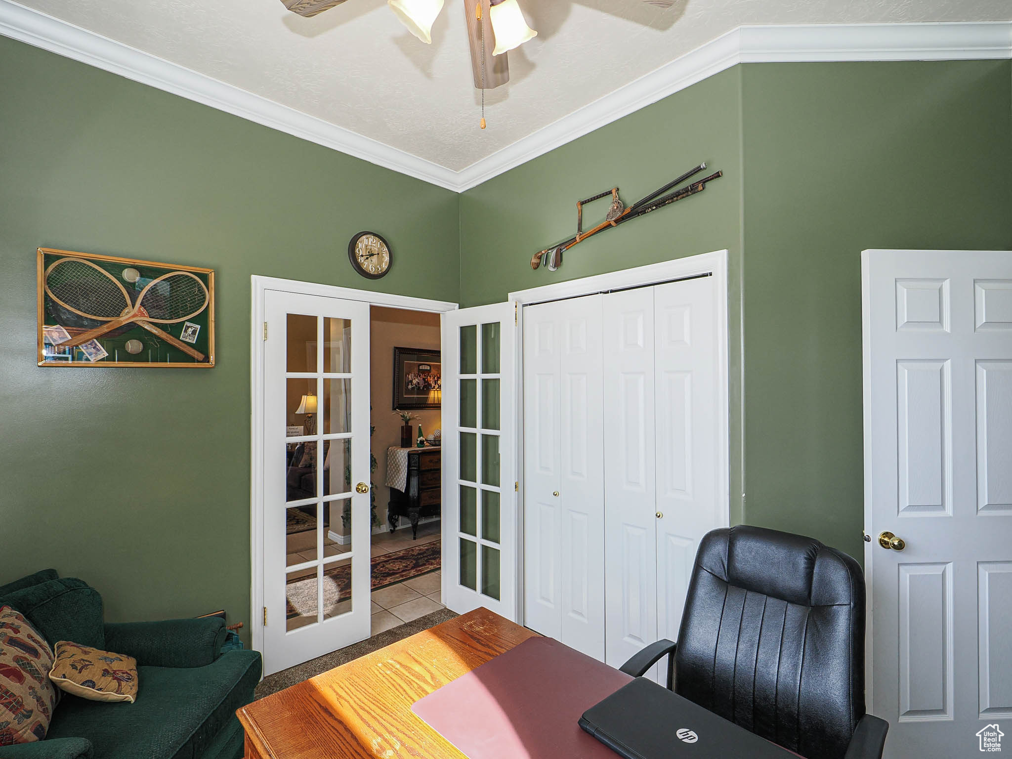 Tiled home office with crown molding, french doors, and ceiling fan