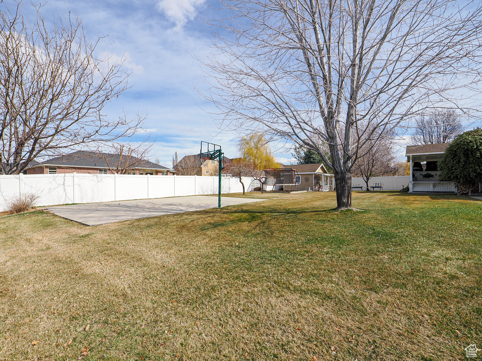 View of yard with a patio area and fence