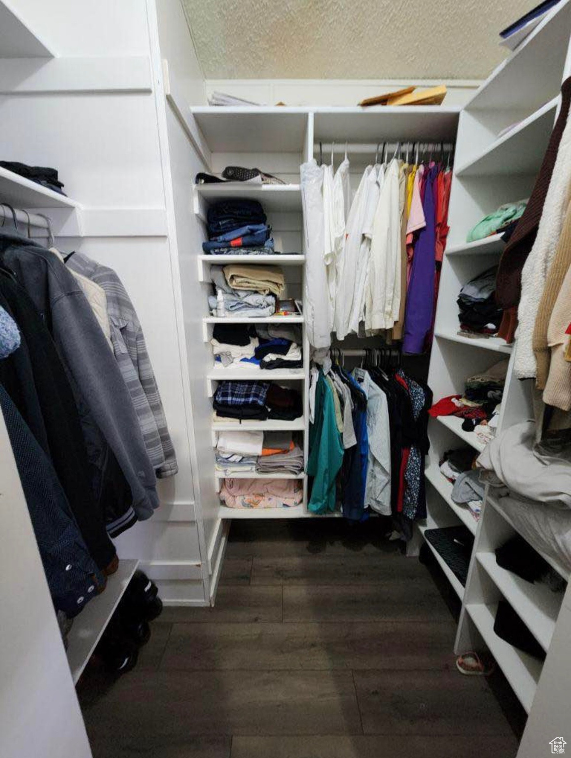 Spacious closet featuring wood finished floors