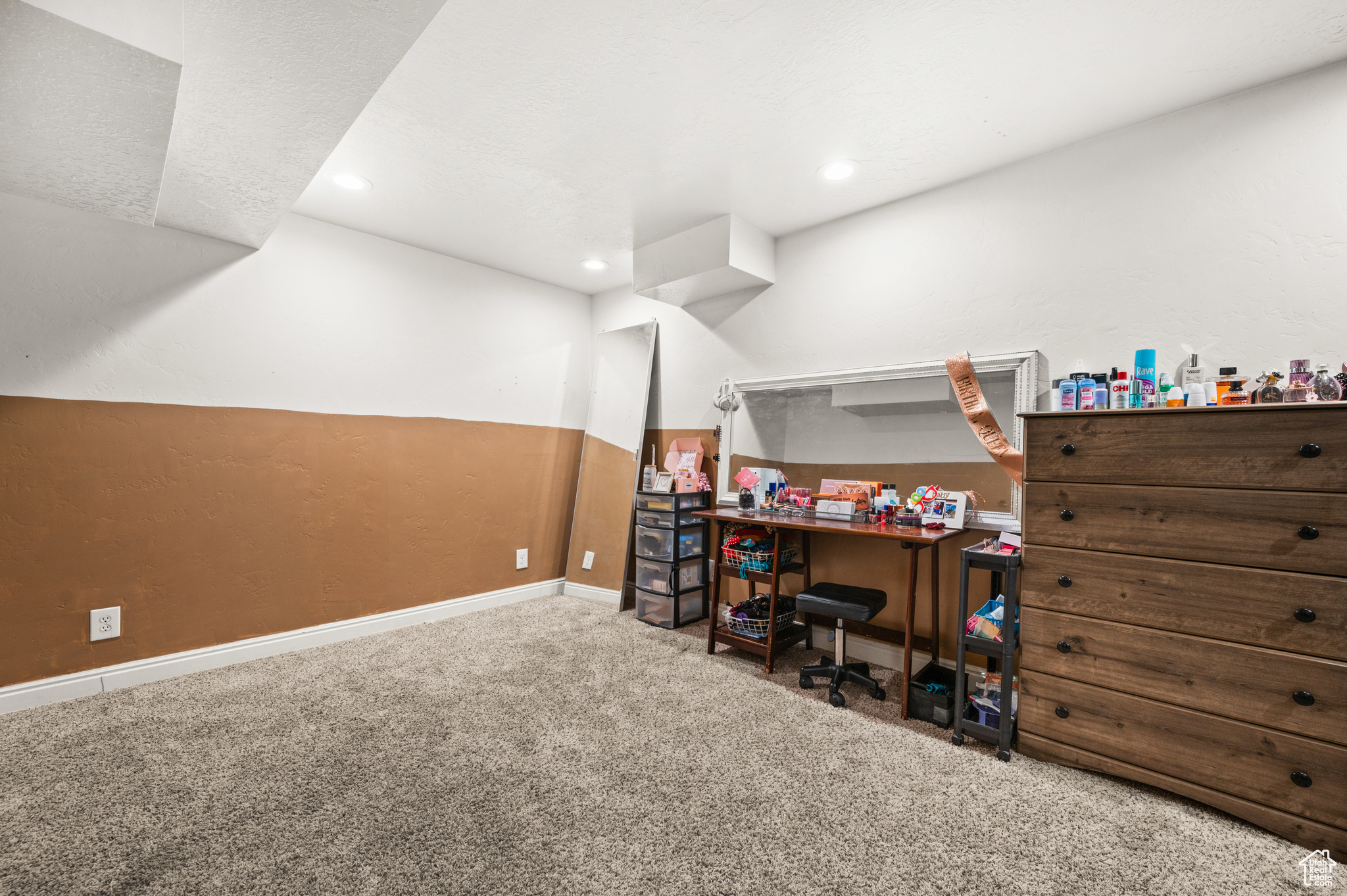 Carpeted office space featuring recessed lighting and baseboards