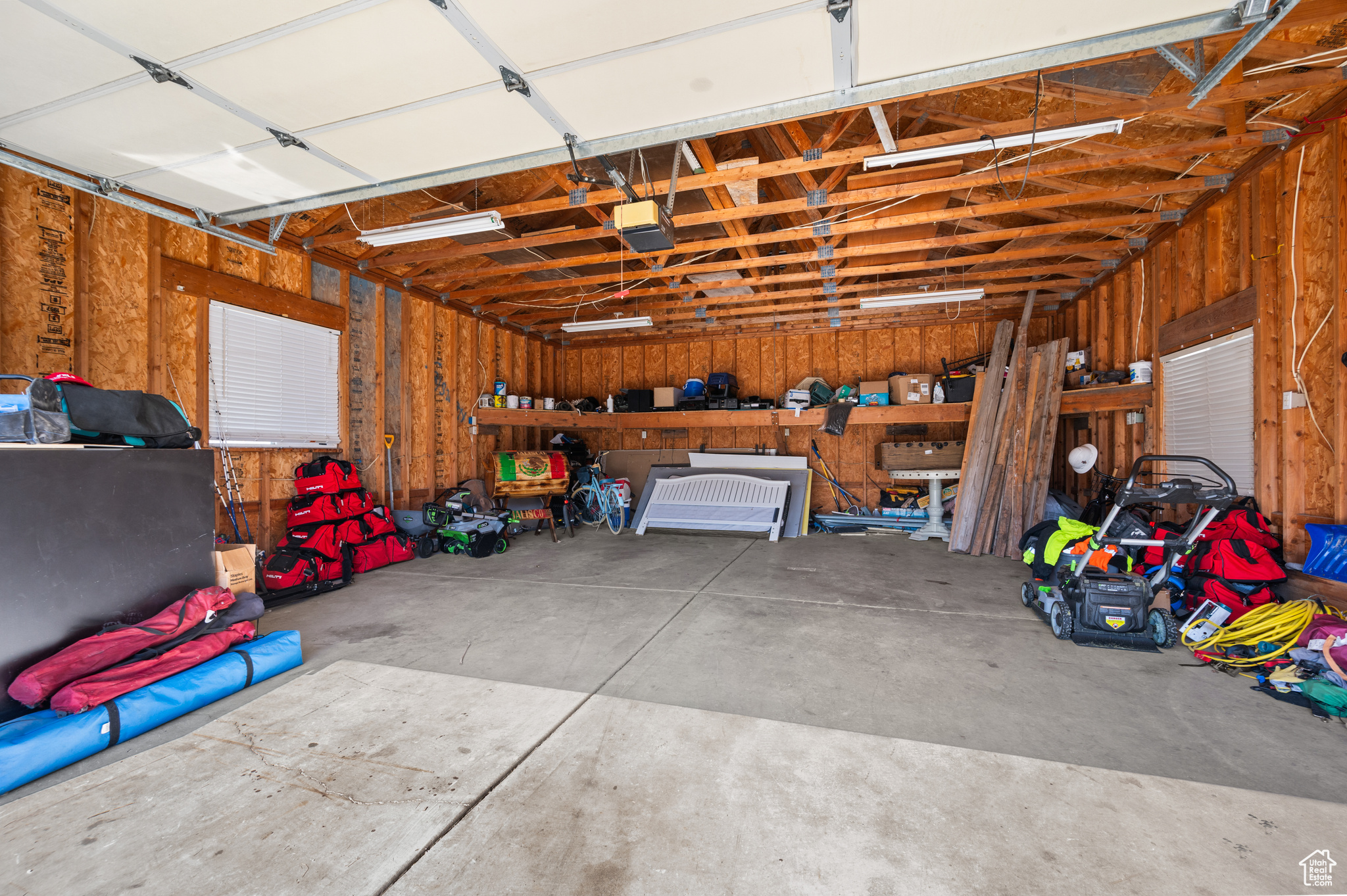 Garage featuring a garage door opener