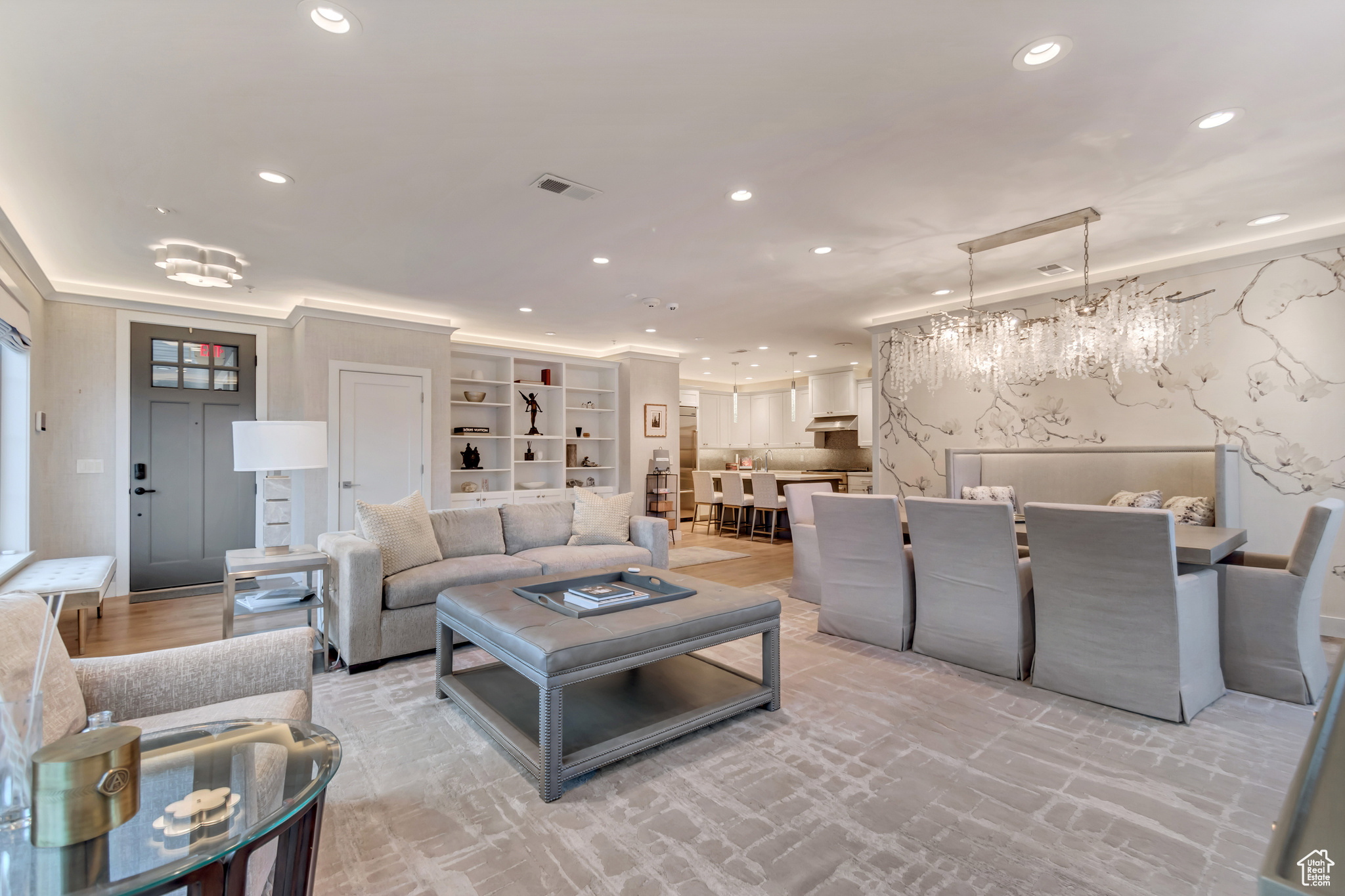 Living area with recessed lighting and visible vents