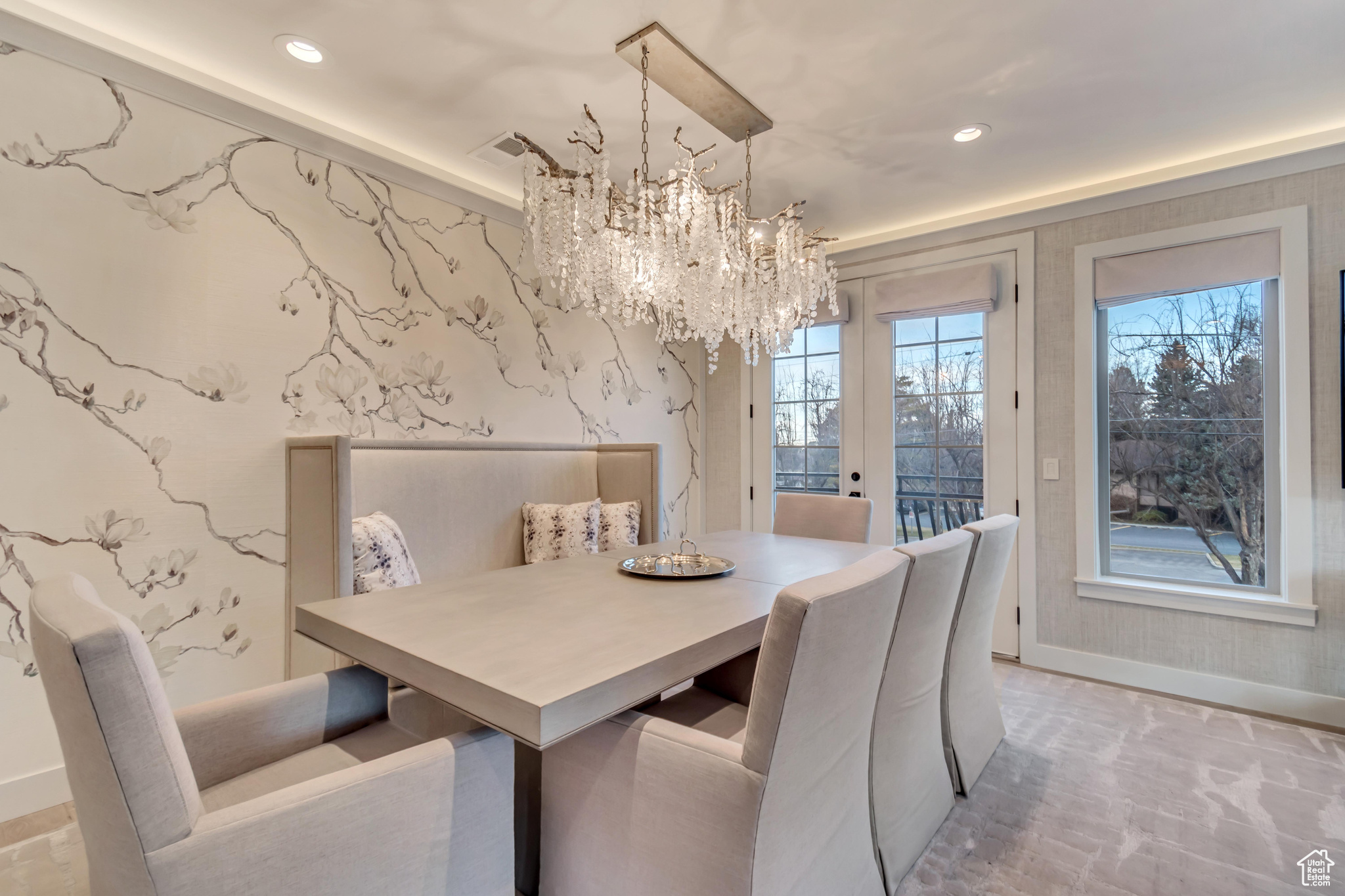 Dining space featuring visible vents, wallpapered walls, baseboards, recessed lighting, and a notable chandelier