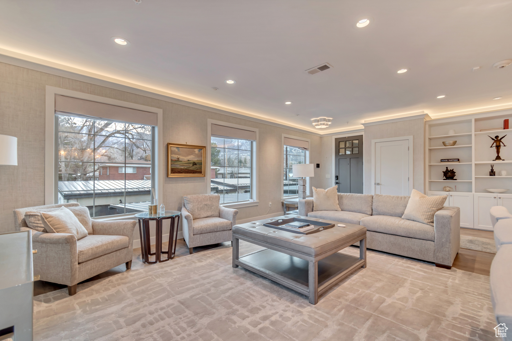 Living room featuring recessed lighting and visible vents