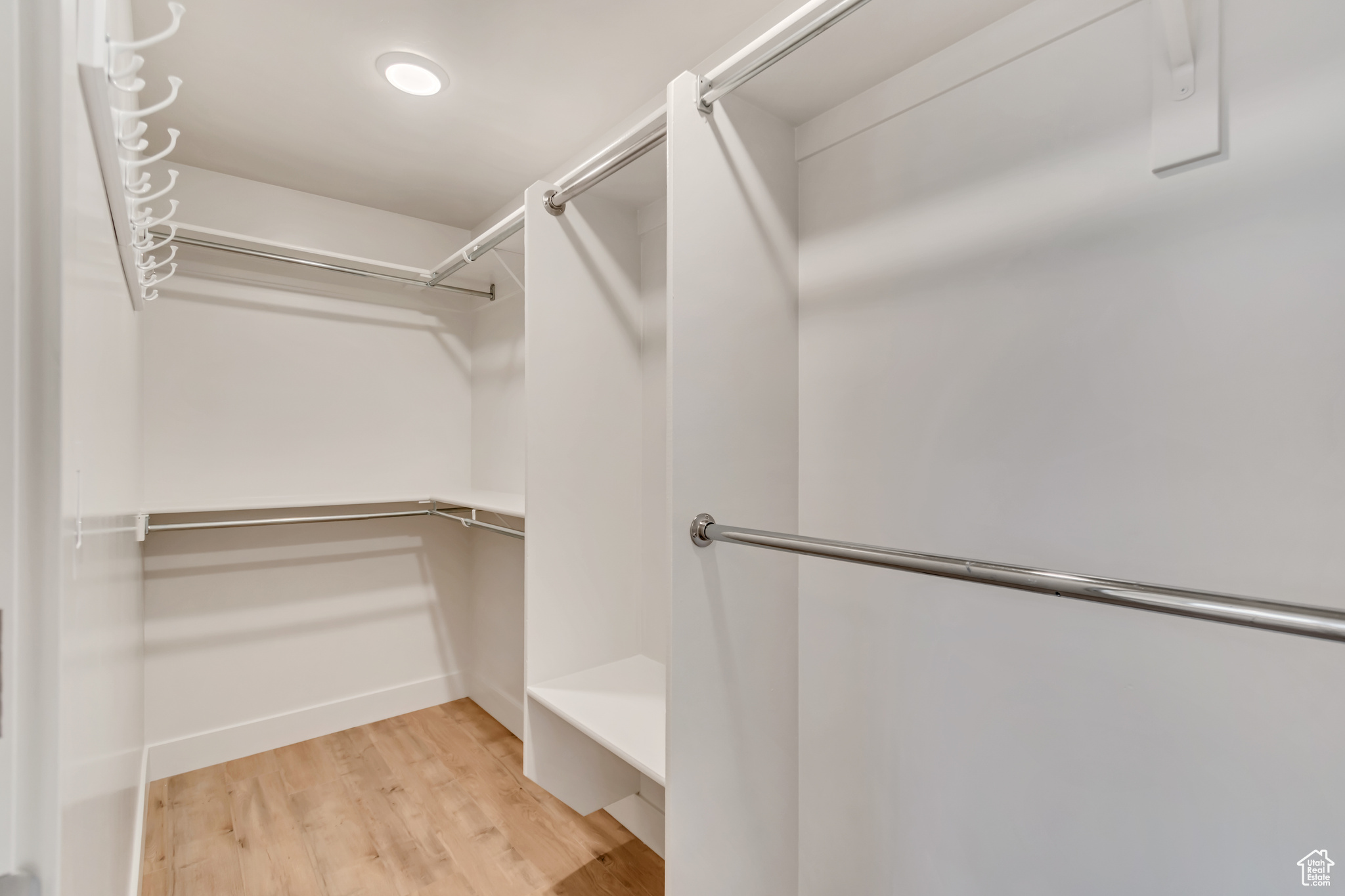 Walk in closet featuring light wood-type flooring