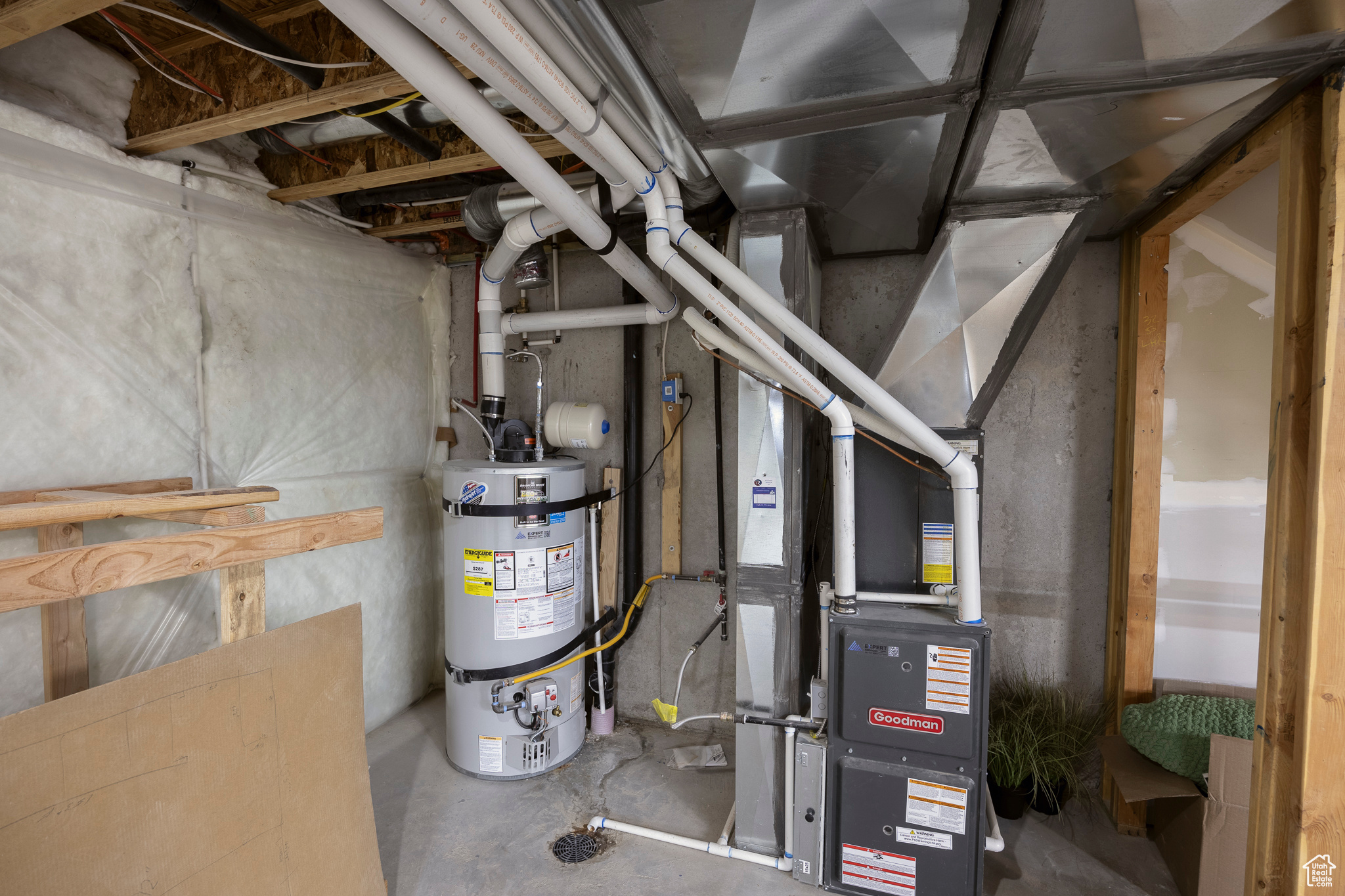 Utility room with strapped water heater