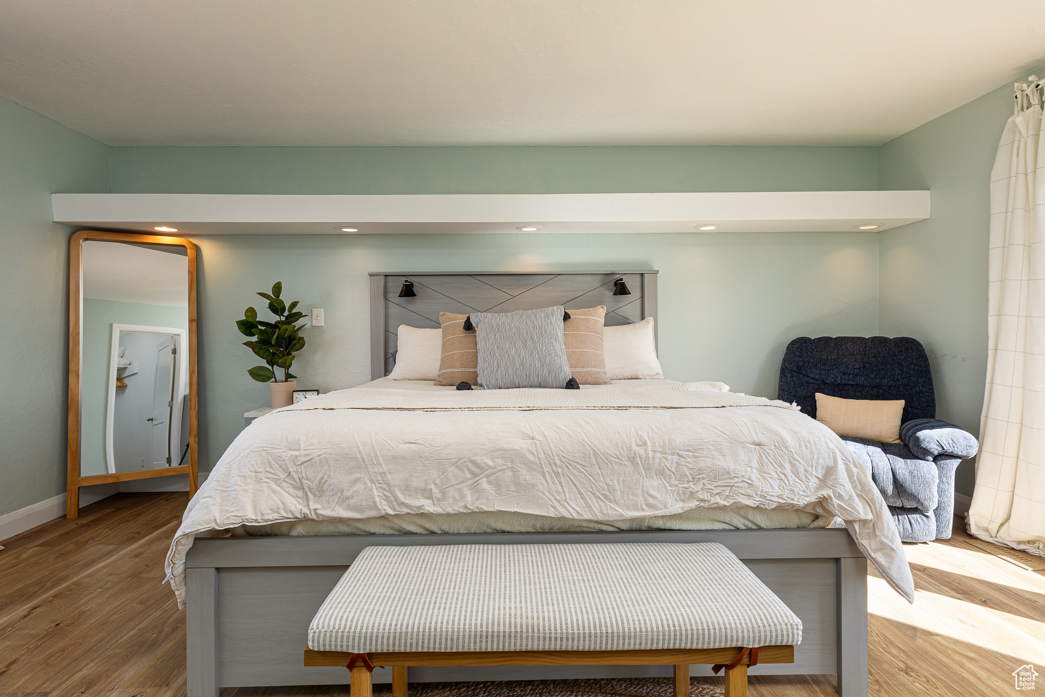 Bedroom with recessed lighting, baseboards, and wood finished floors