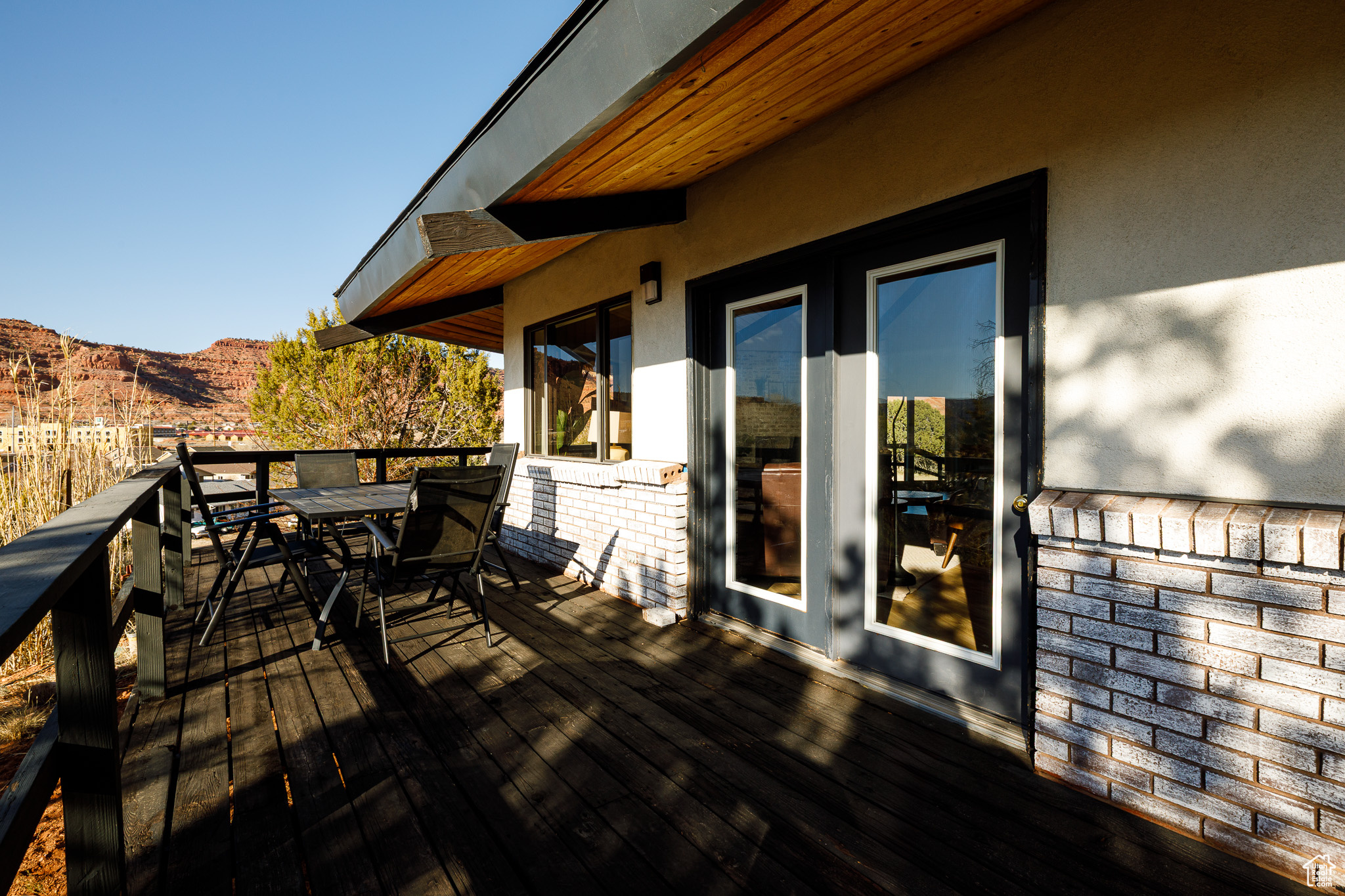 Deck featuring a mountain view and outdoor dining area