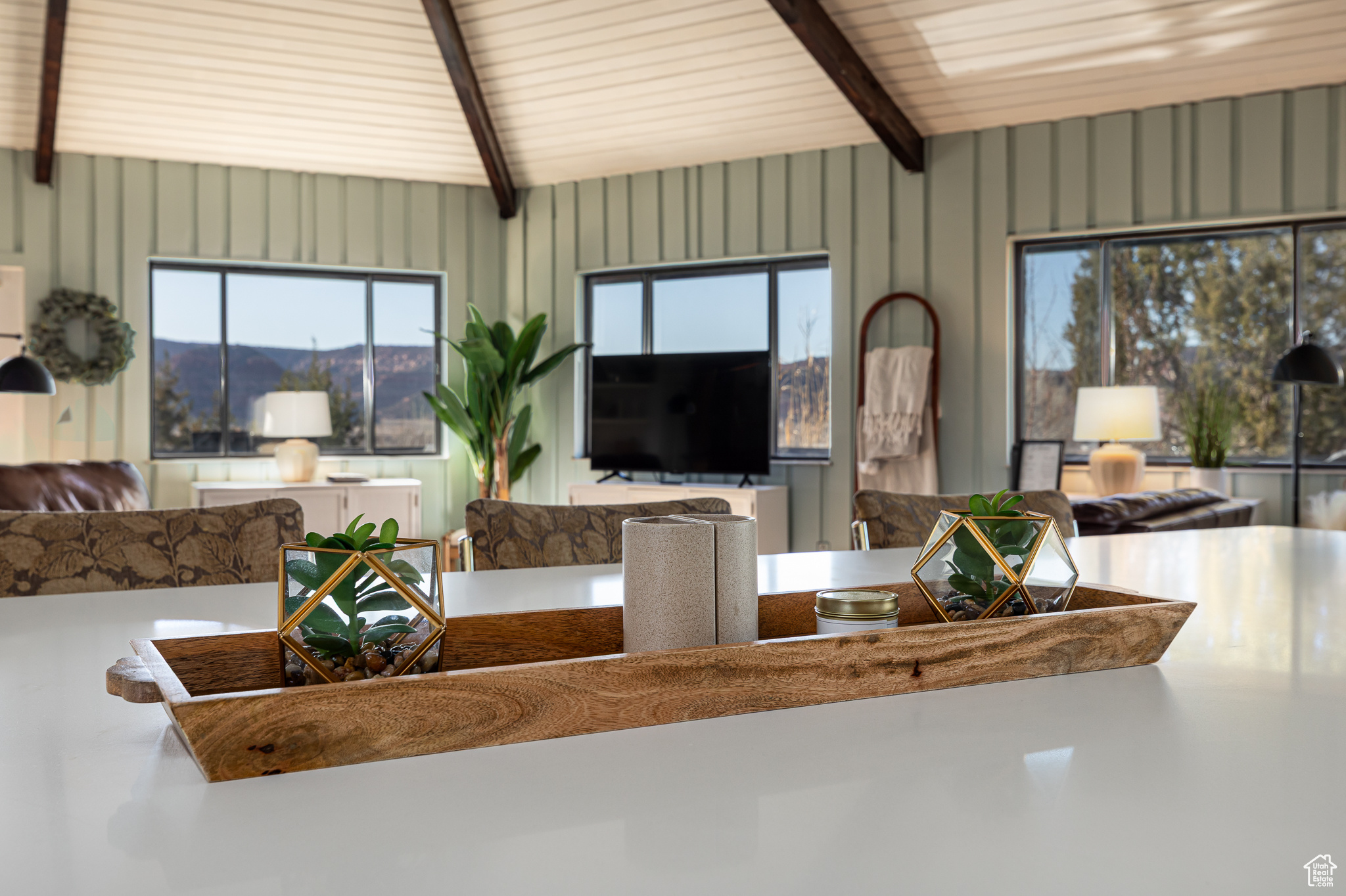 Living area featuring beam ceiling