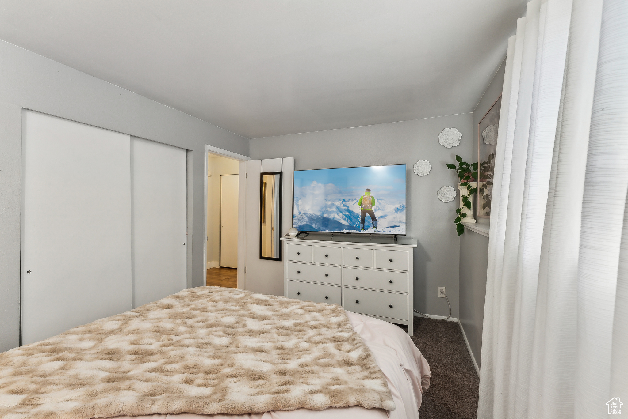 Bedroom with a closet and carpet flooring