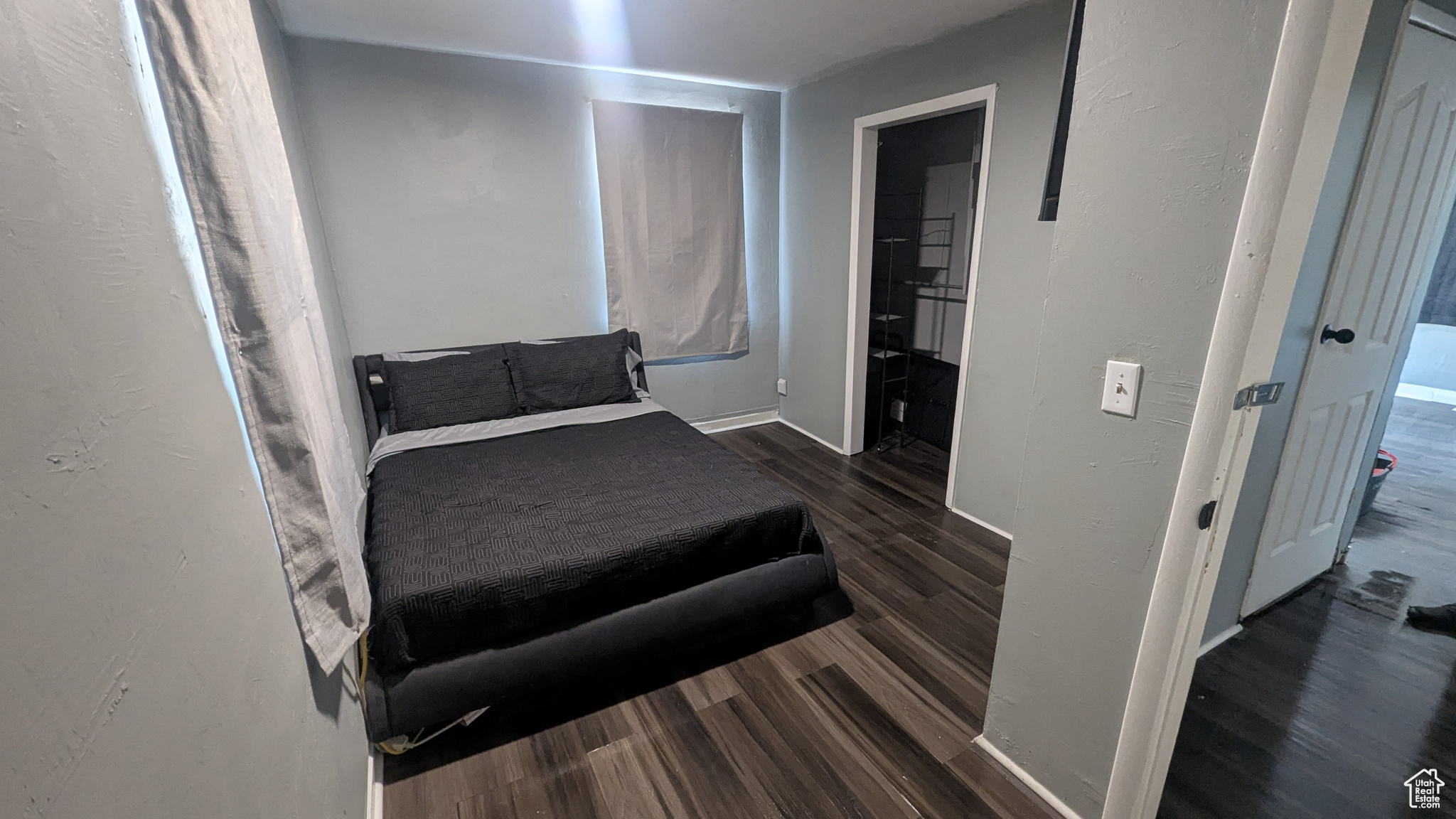 Bedroom featuring dark wood-style flooring