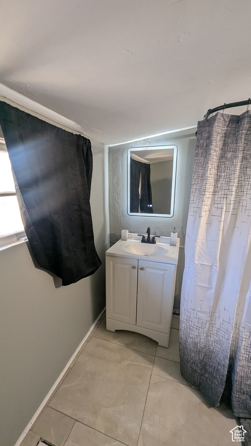 Bathroom with baseboards and vanity