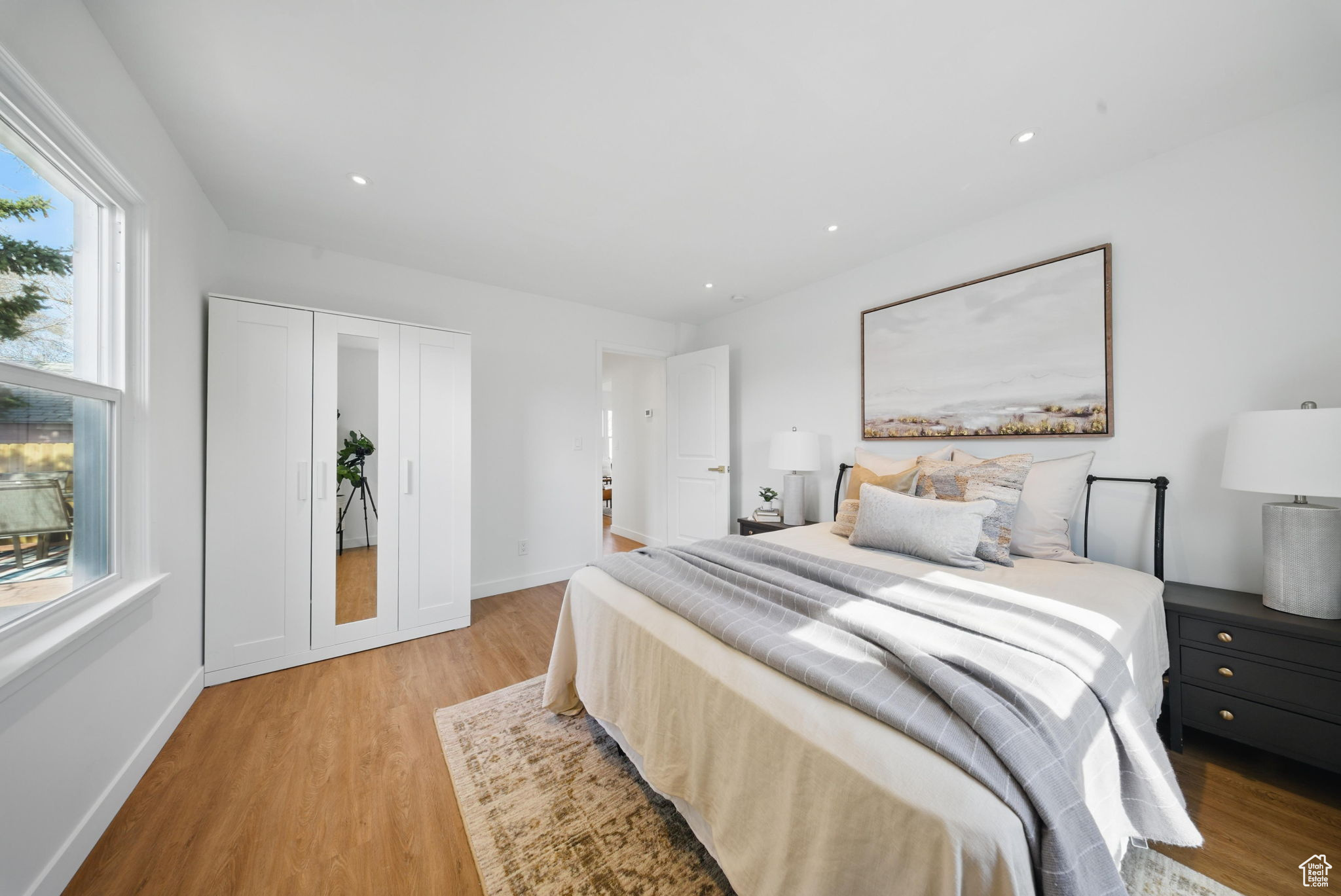 Bedroom featuring recessed lighting, a closet, baseboards, and light wood-style flooring