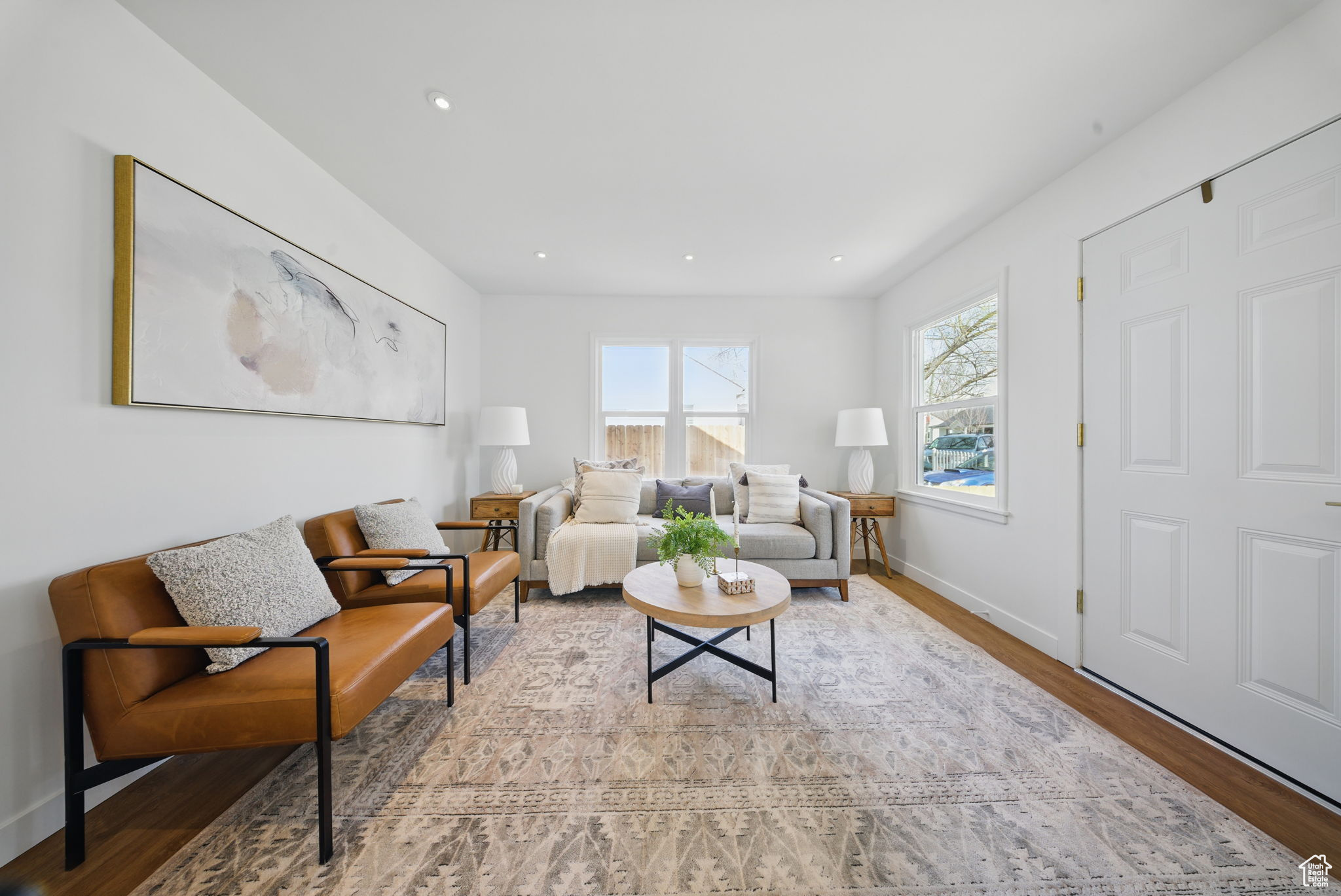 Living area featuring recessed lighting, baseboards, and wood finished floors