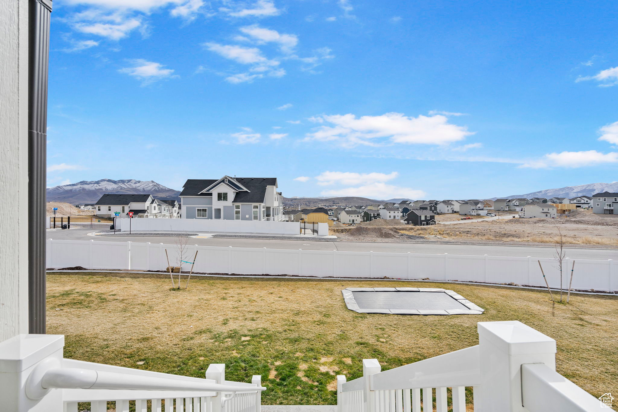 View of yard featuring a mountain view, a residential view, and a fenced backyard