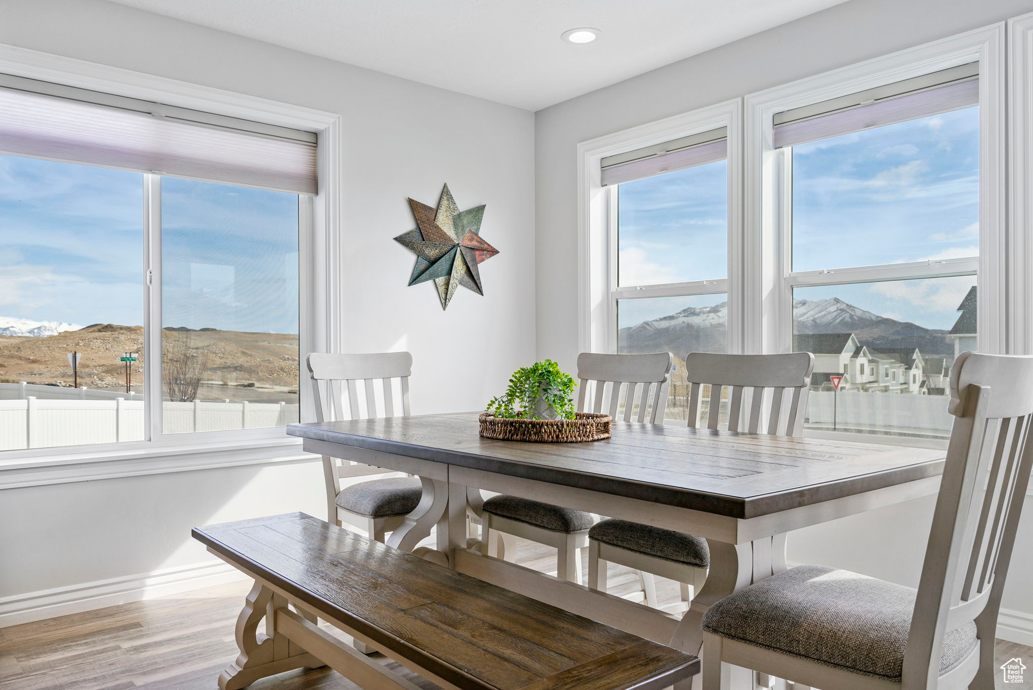 Dining room with recessed lighting, light wood-type flooring, and baseboards