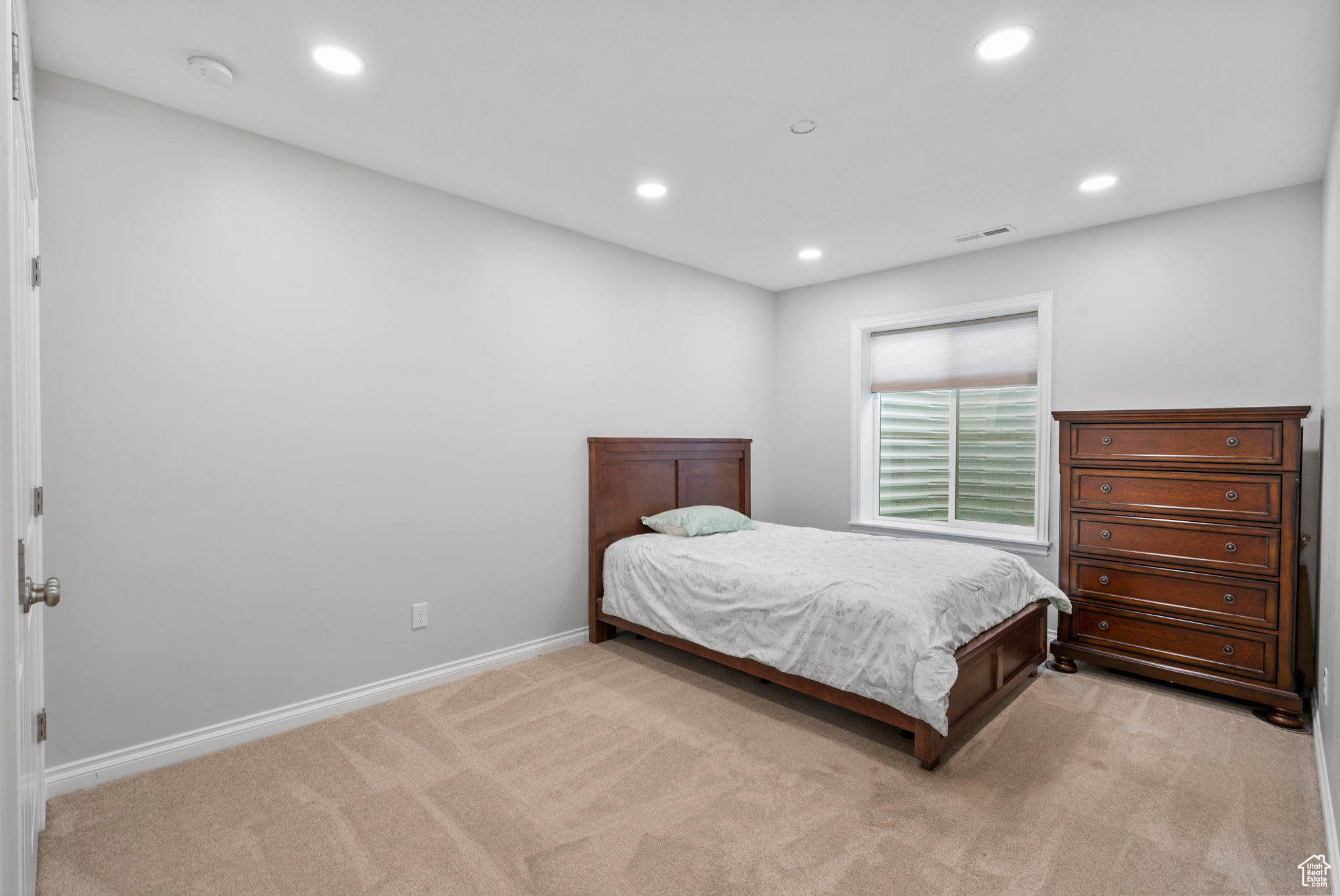 Bedroom with visible vents, recessed lighting, light colored carpet, and baseboards