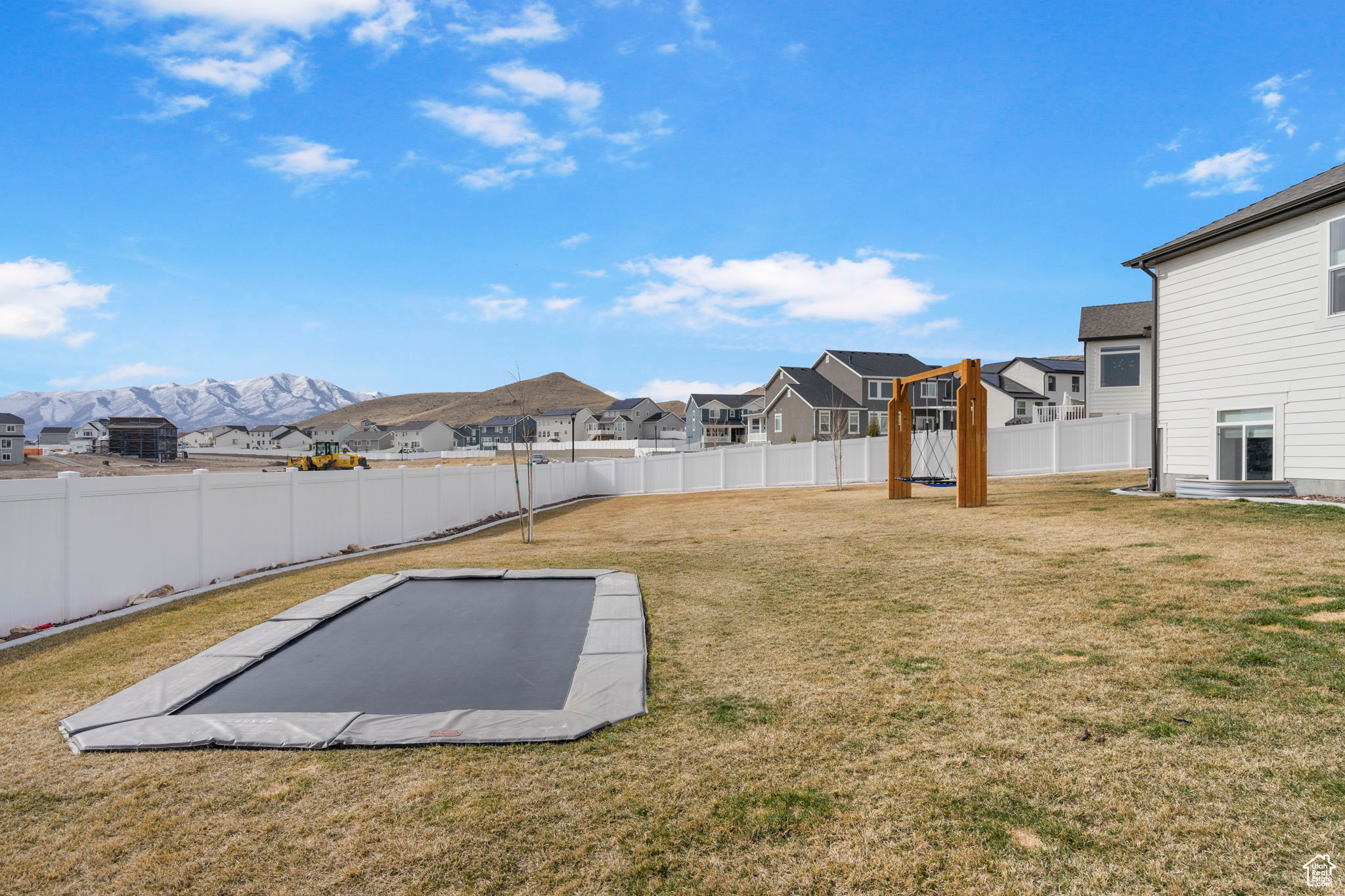 View of yard with a residential view, a mountain view, and a fenced backyard