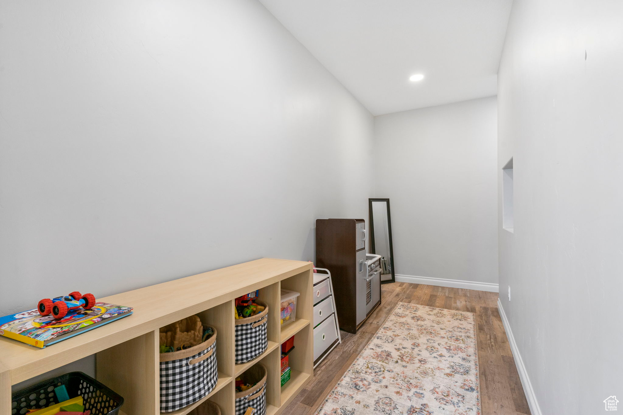 Game room with light wood finished floors, recessed lighting, and baseboards