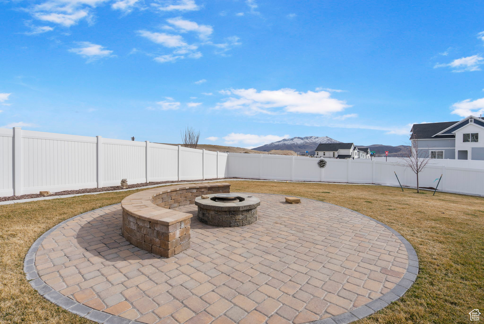 View of patio / terrace with a fire pit and a fenced backyard