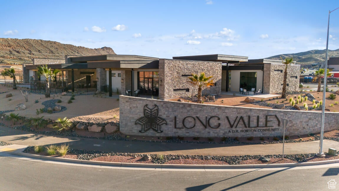 Community sign featuring a mountain view