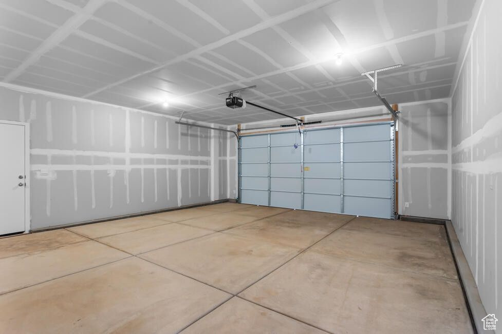 Garage featuring a garage door opener