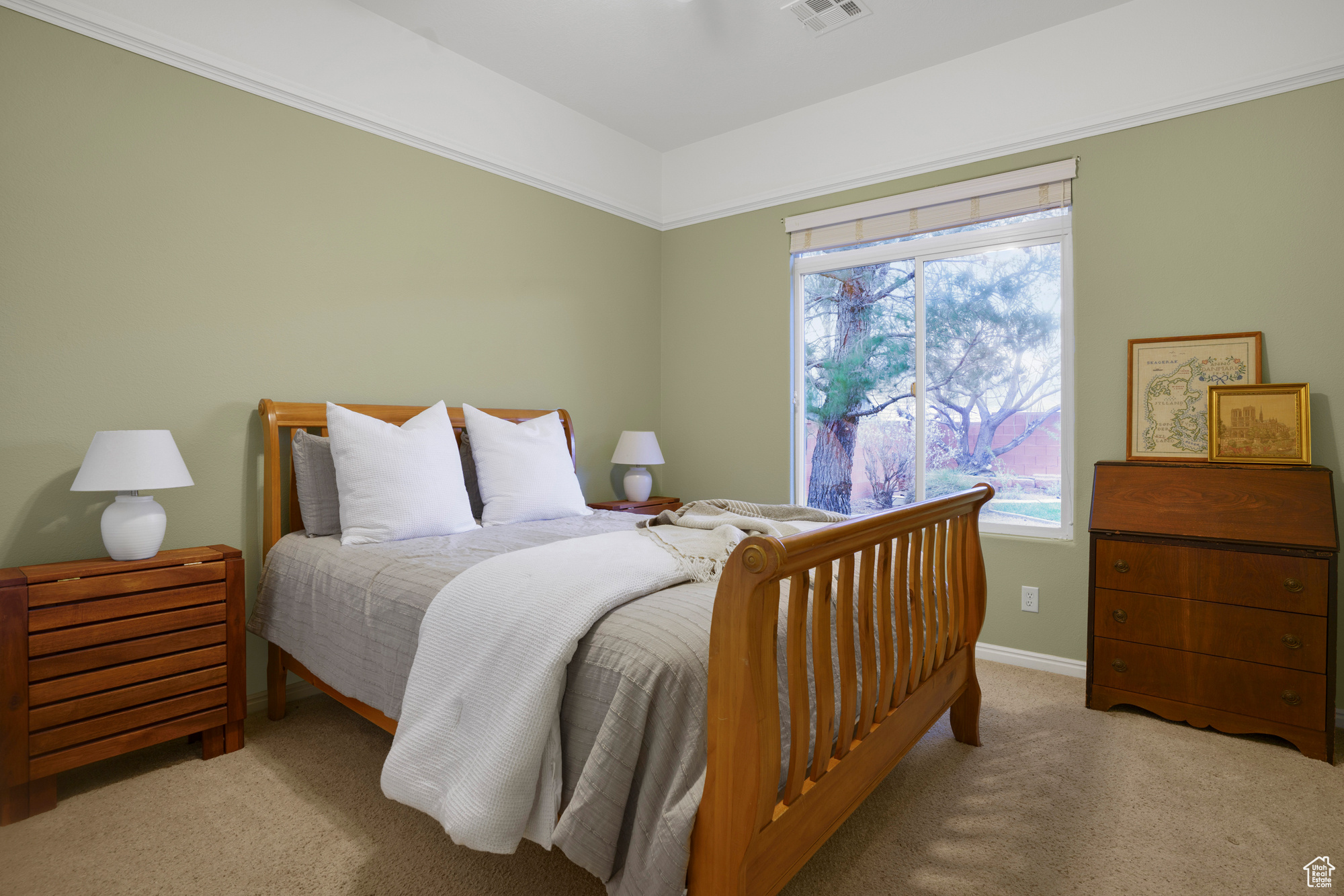 Bedroom with baseboards, visible vents, and carpet floors