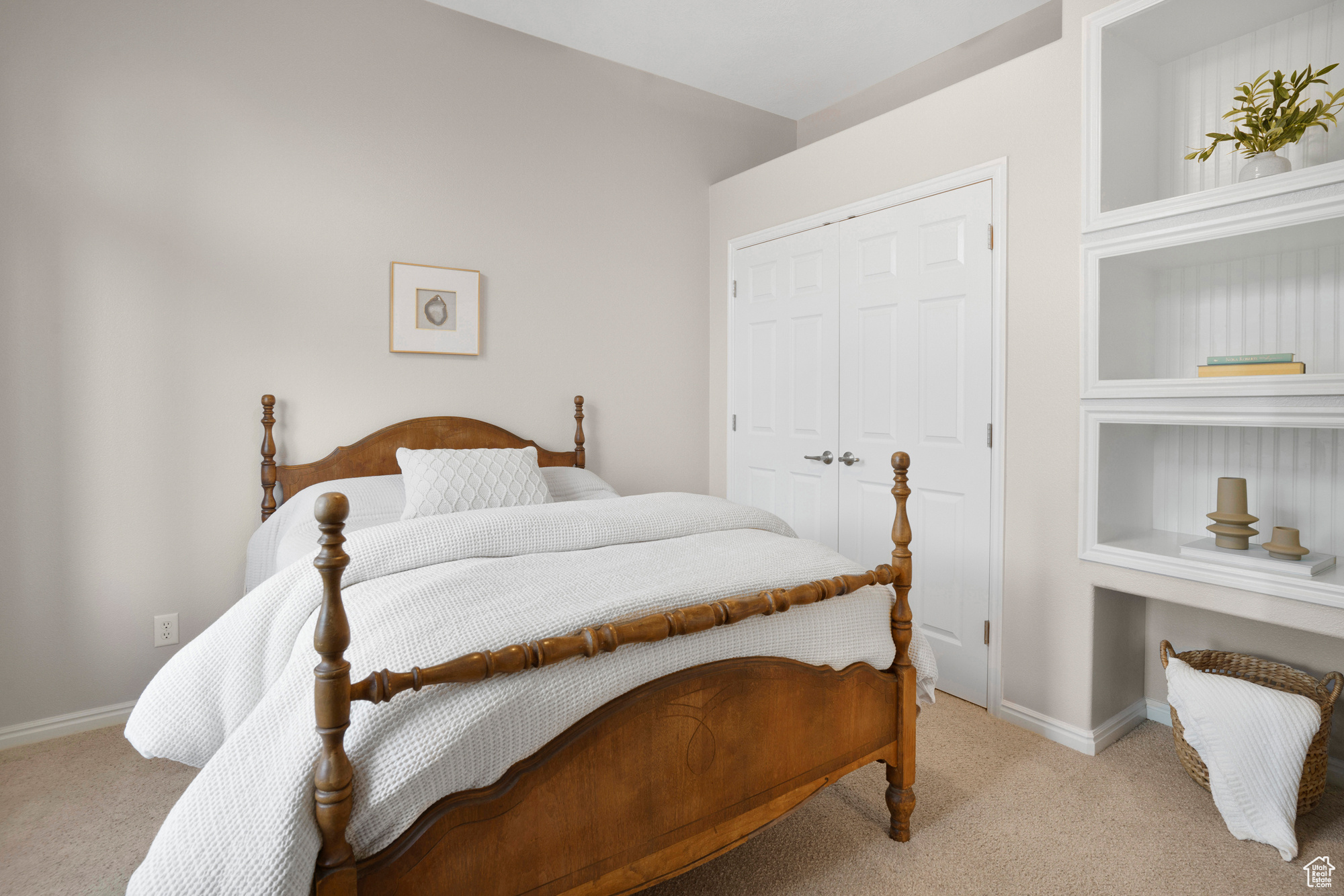 Bedroom with a closet, baseboards, and carpet floors