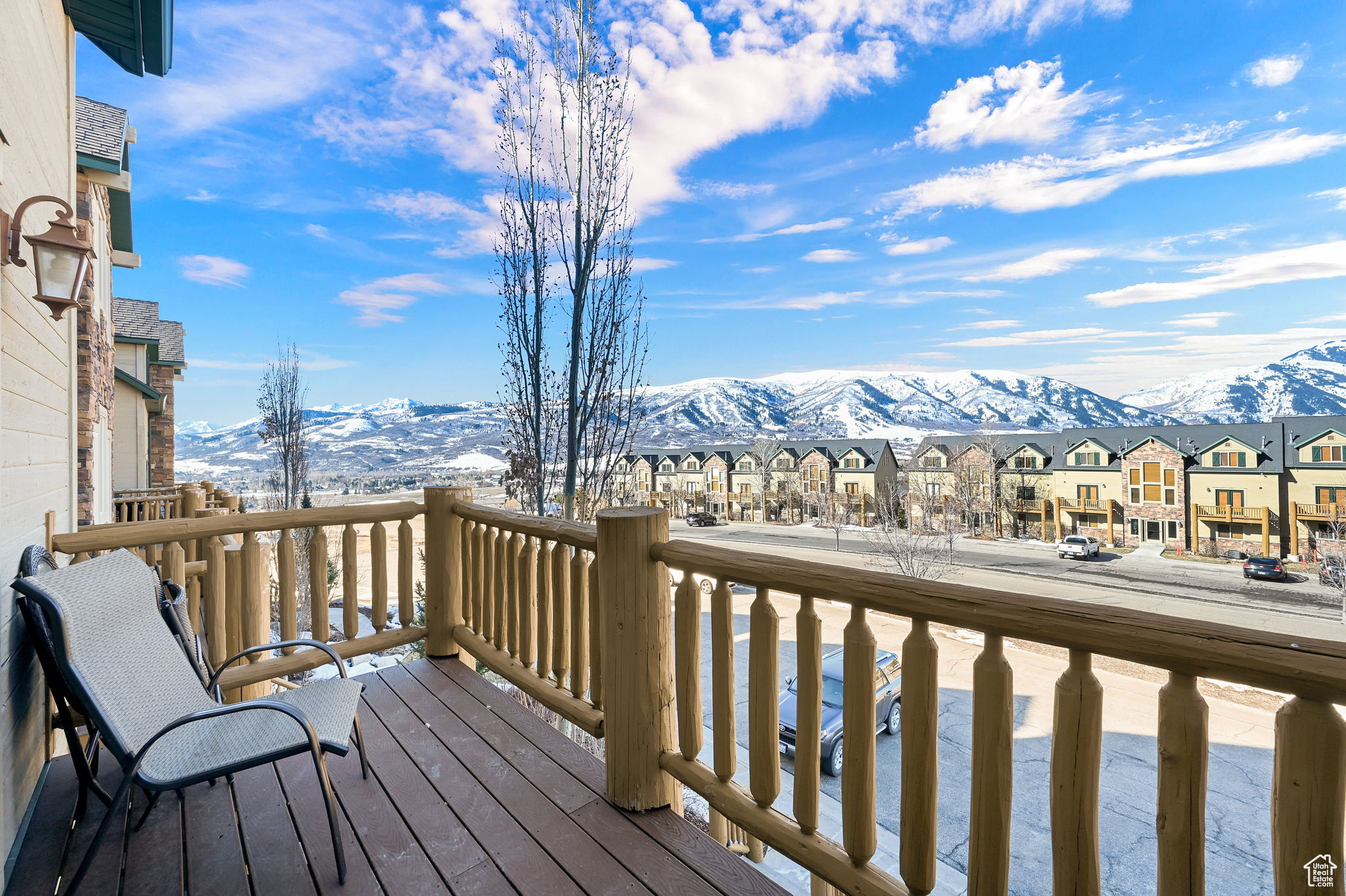 Deck featuring a mountain view and a residential view