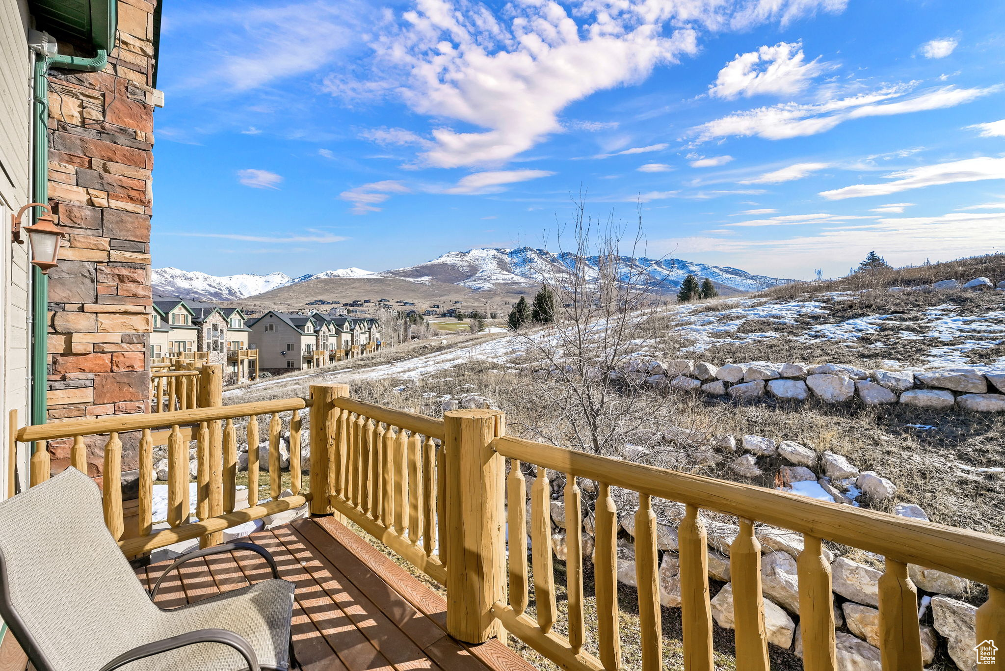 Deck featuring a residential view and a mountain view