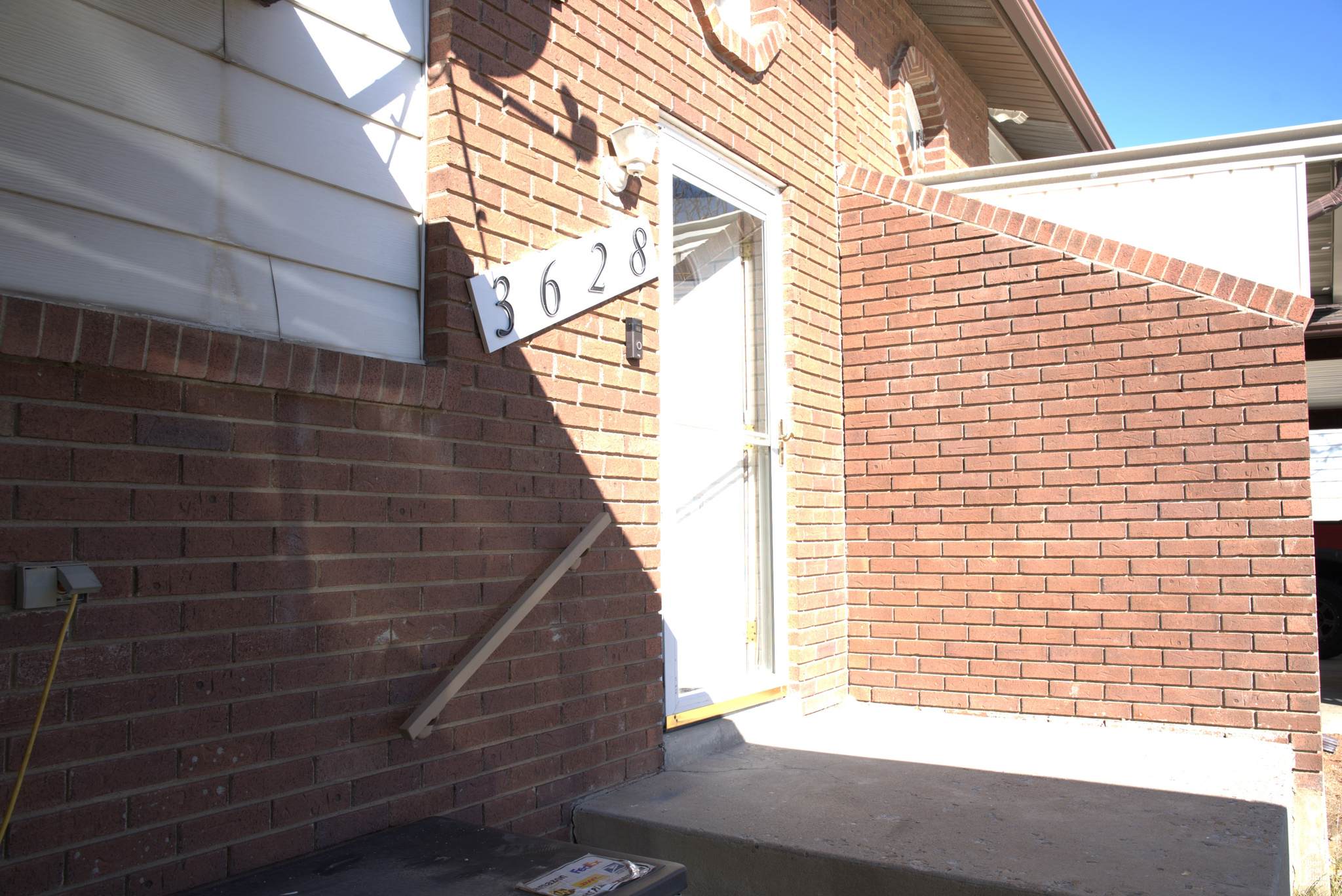 Exterior space featuring brick siding