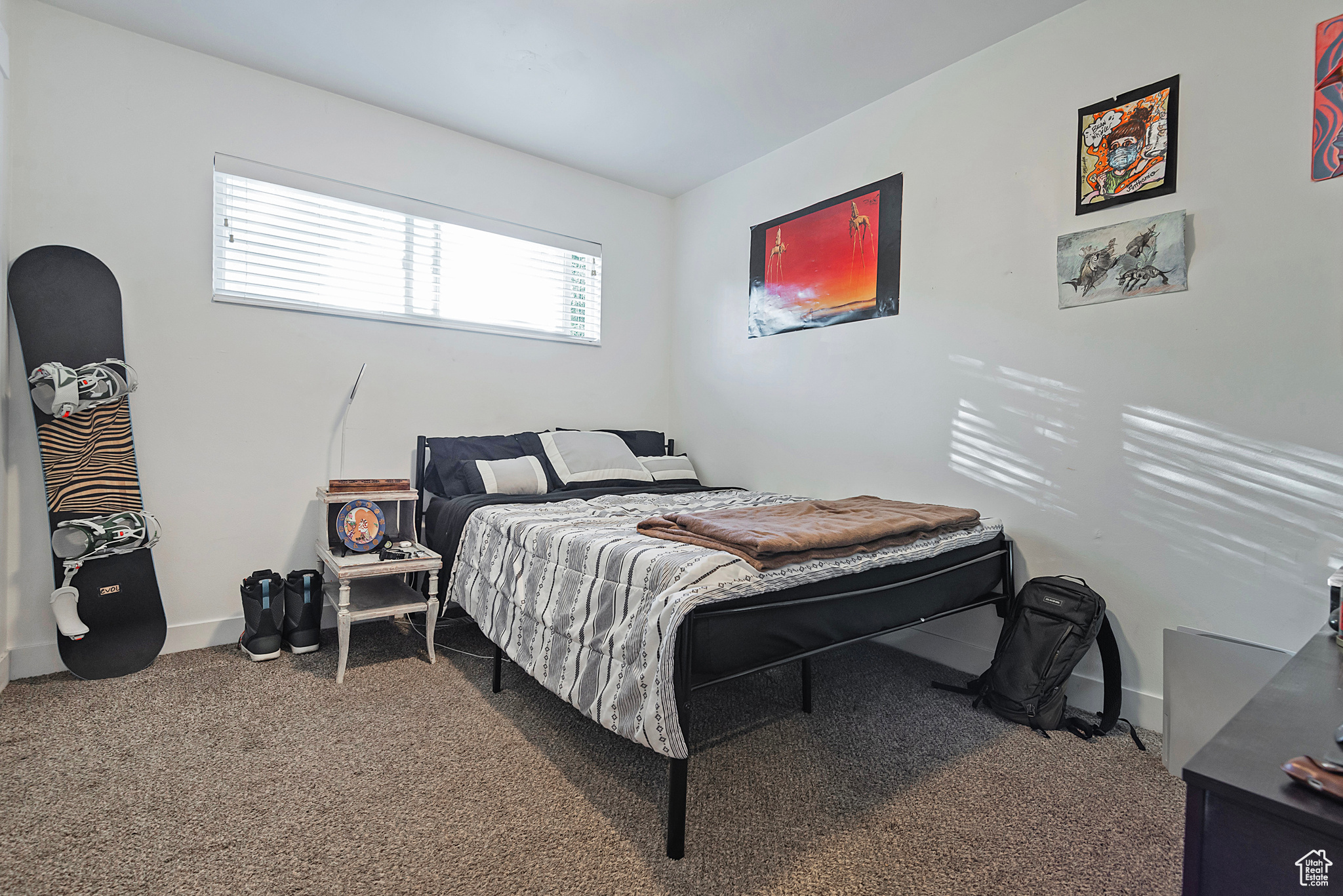 Bedroom with carpet flooring and baseboards