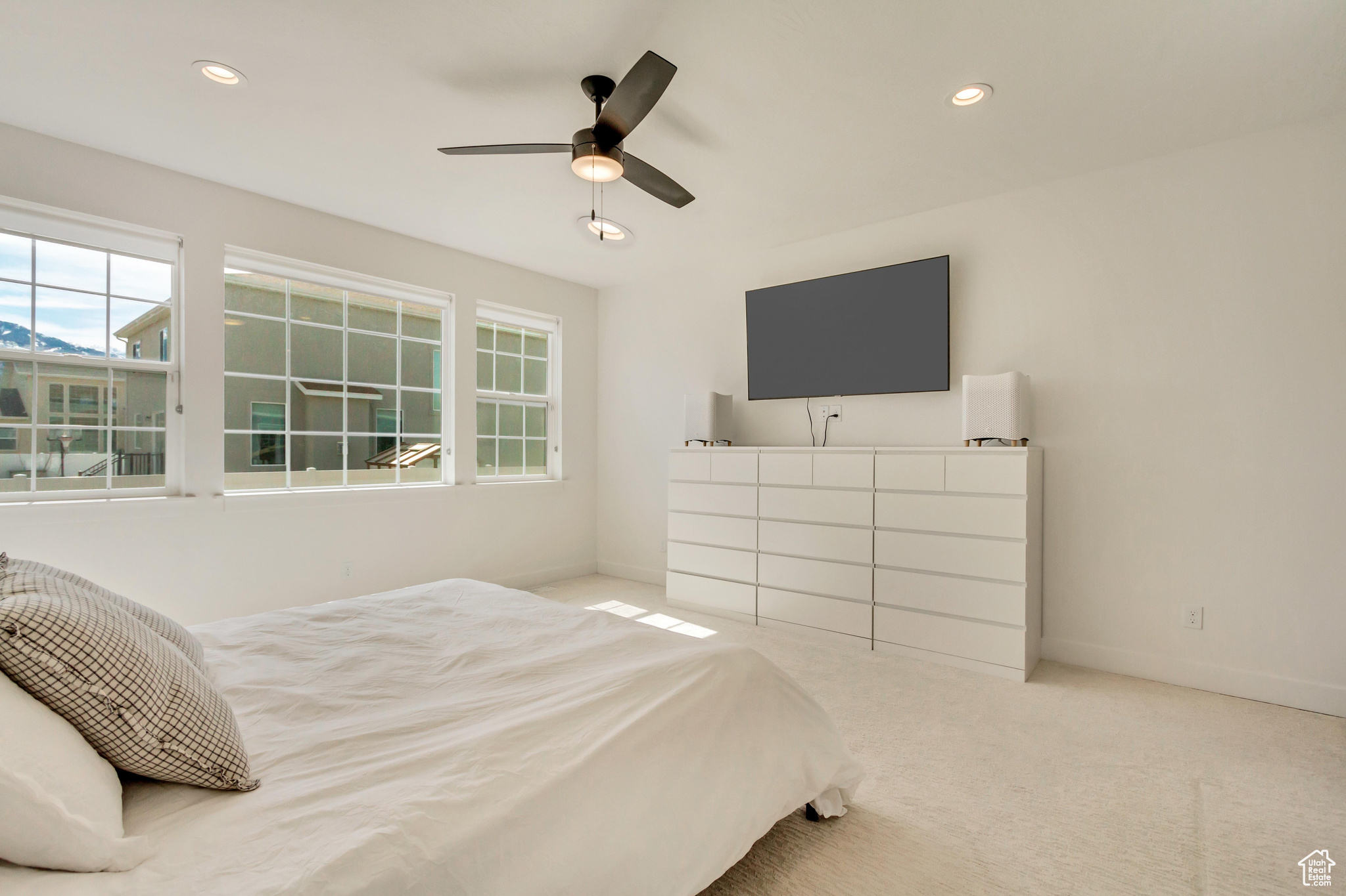 Carpeted bedroom with recessed lighting, a ceiling fan, and baseboards