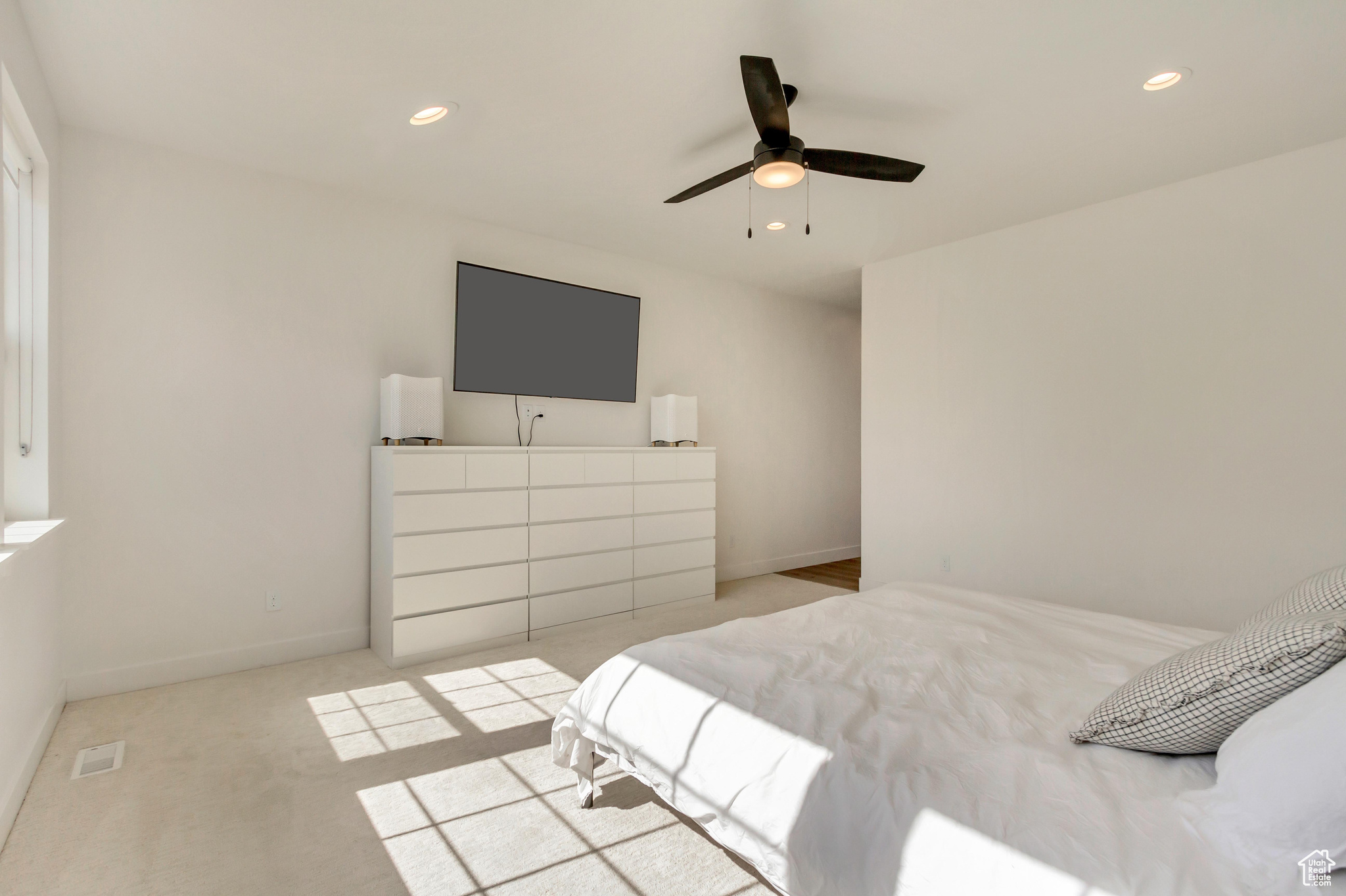 Carpeted bedroom with recessed lighting, baseboards, and a ceiling fan