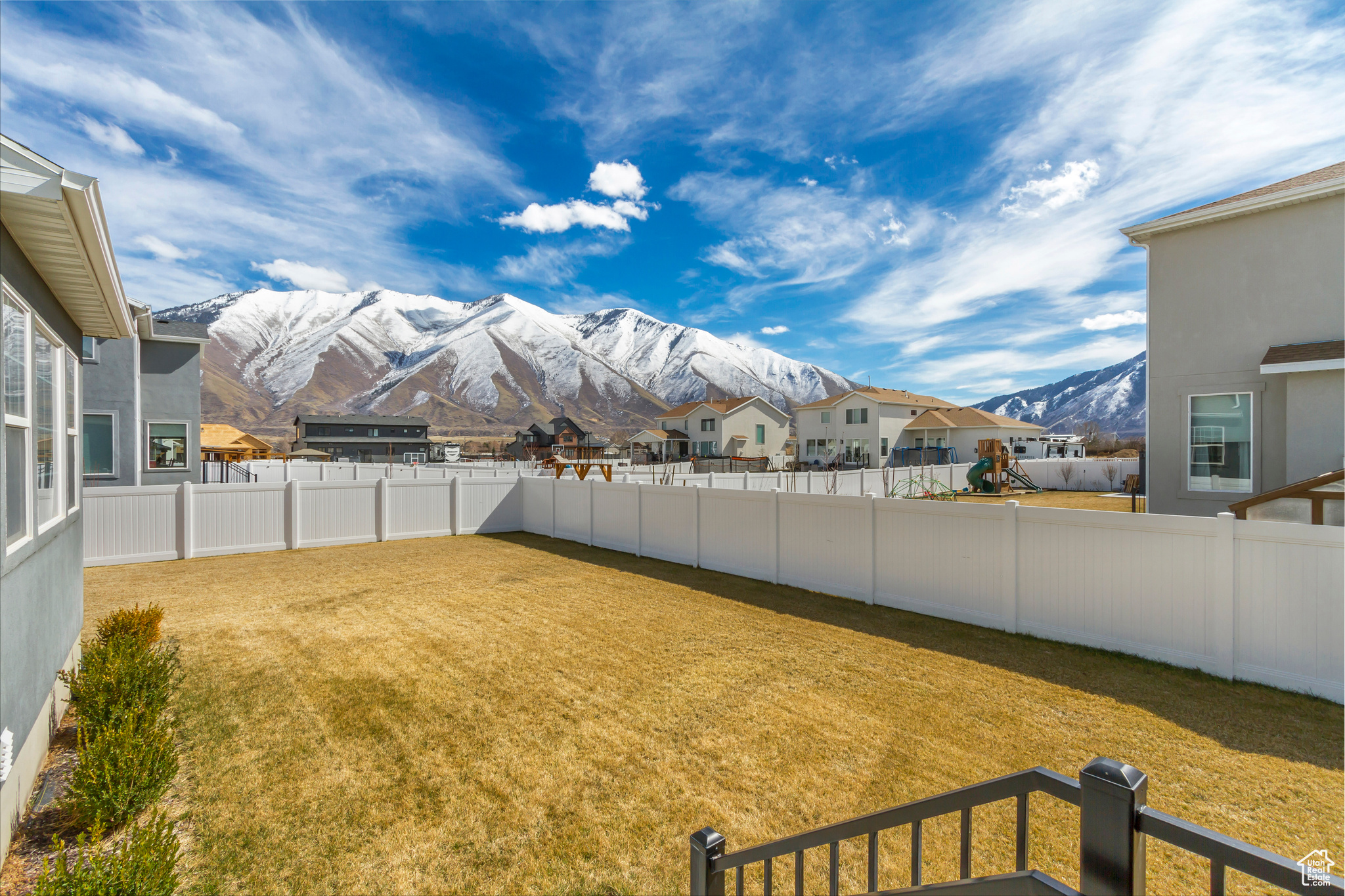 View of yard with a mountain view and a fenced backyard