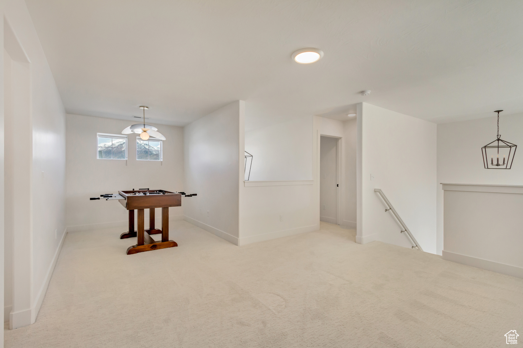 Interior space with baseboards and carpet flooring