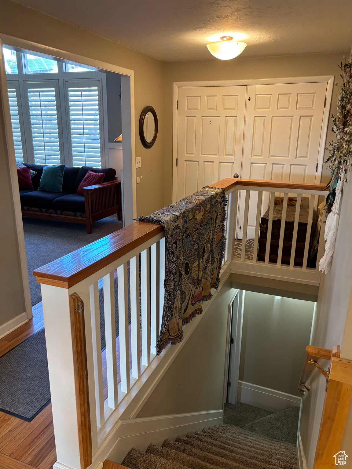 Stairway featuring baseboards and wood finished floors