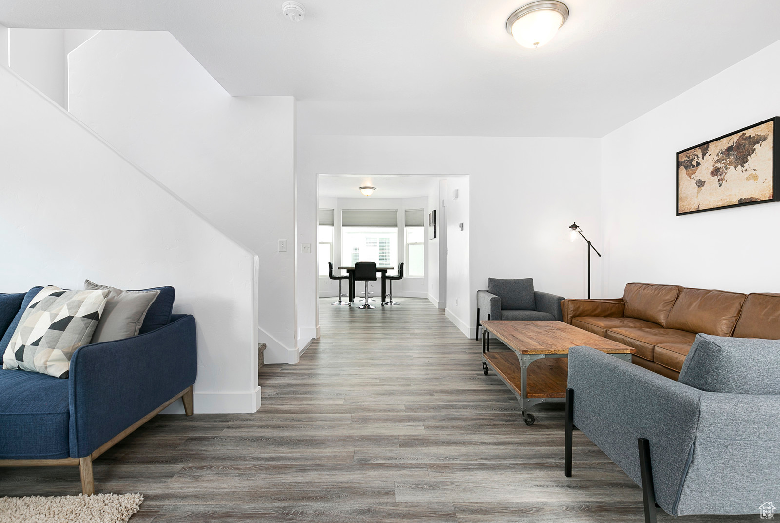 Living room with baseboards and wood finished floors