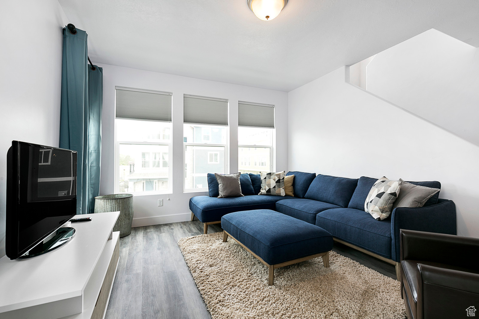 Living room featuring baseboards and wood finished floors