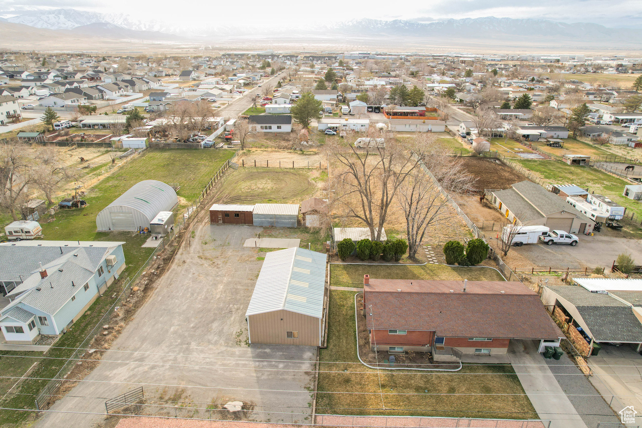 Birds eye view of property with a mountain view and a residential view