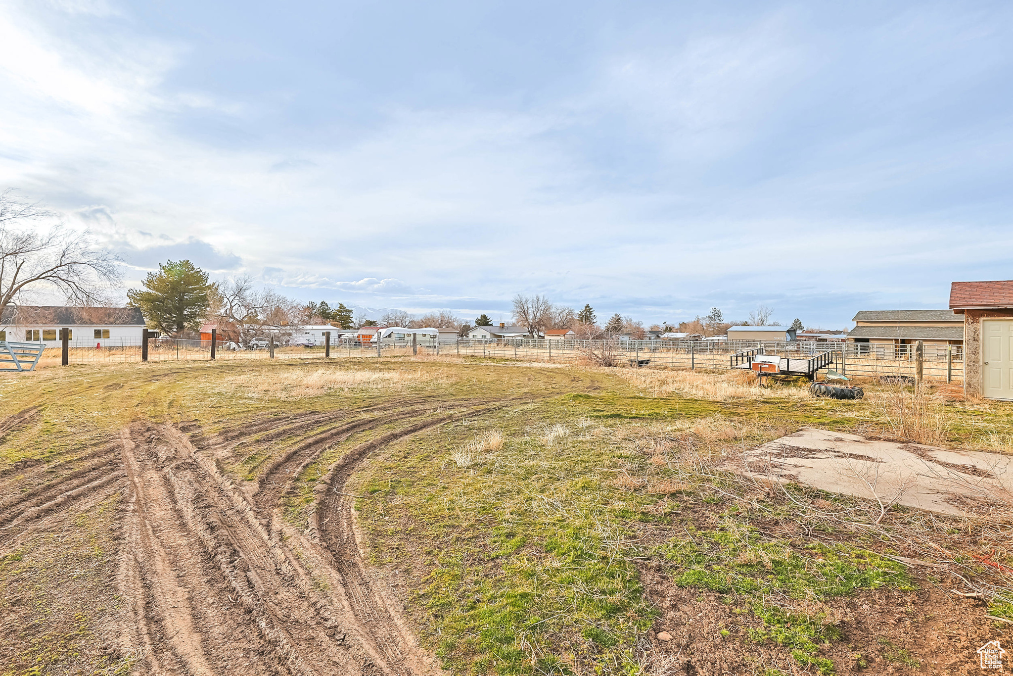 View of yard featuring a rural view and fence