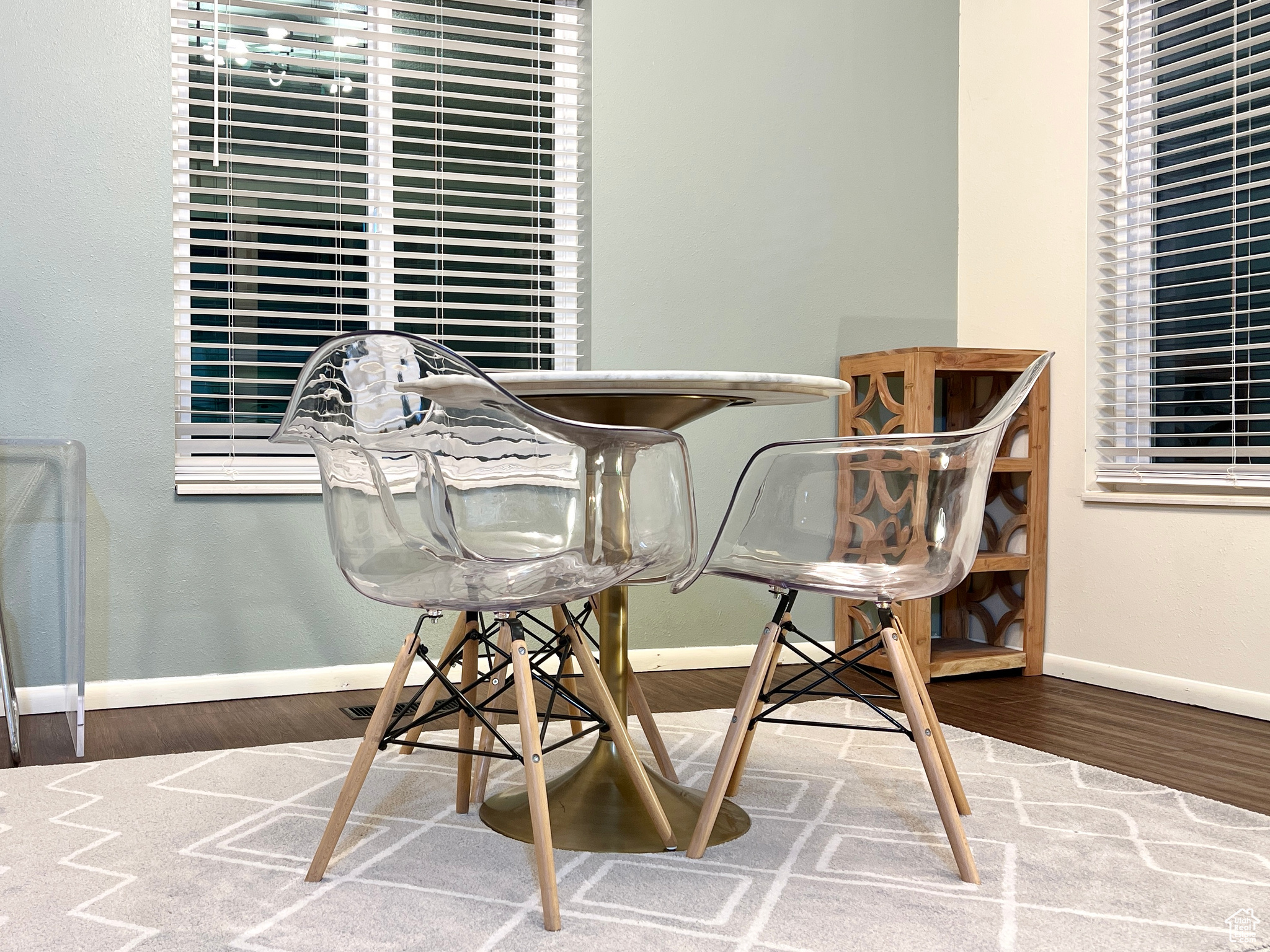 Dining space with baseboards and wood finished floors