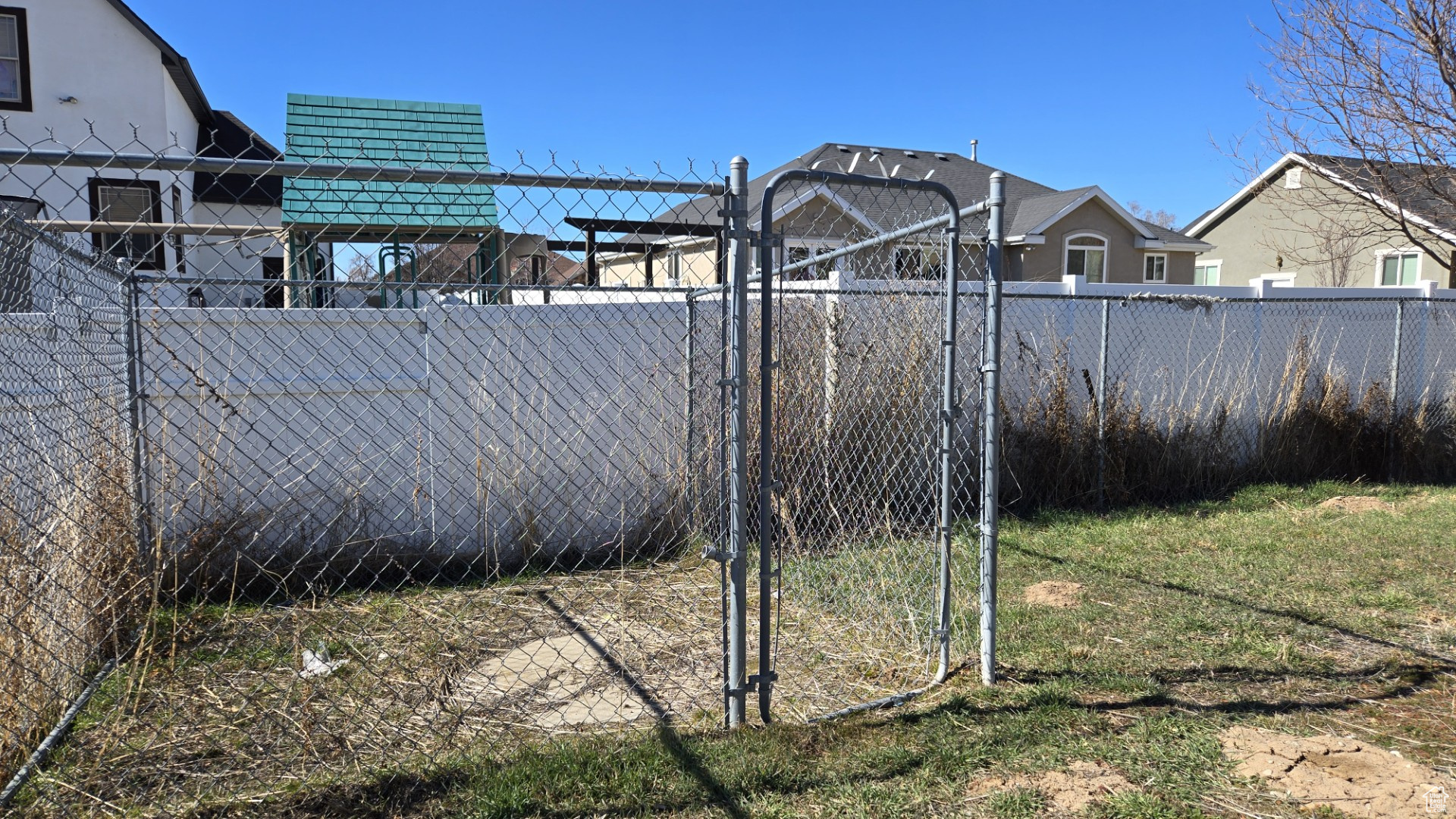 View of yard featuring fence