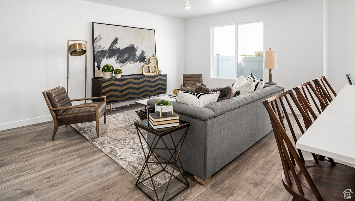 Living area featuring wood finished floors and baseboards