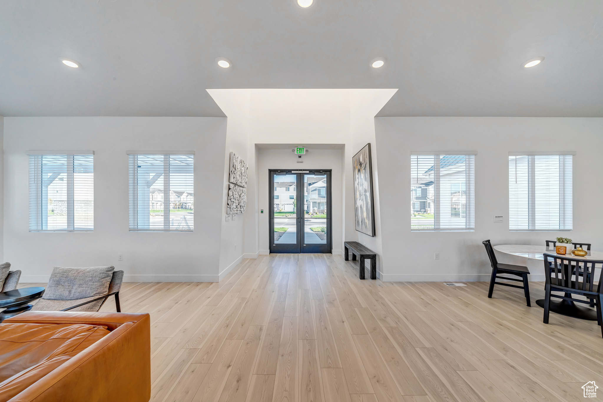 Foyer with recessed lighting, light wood-style floors, and a healthy amount of sunlight