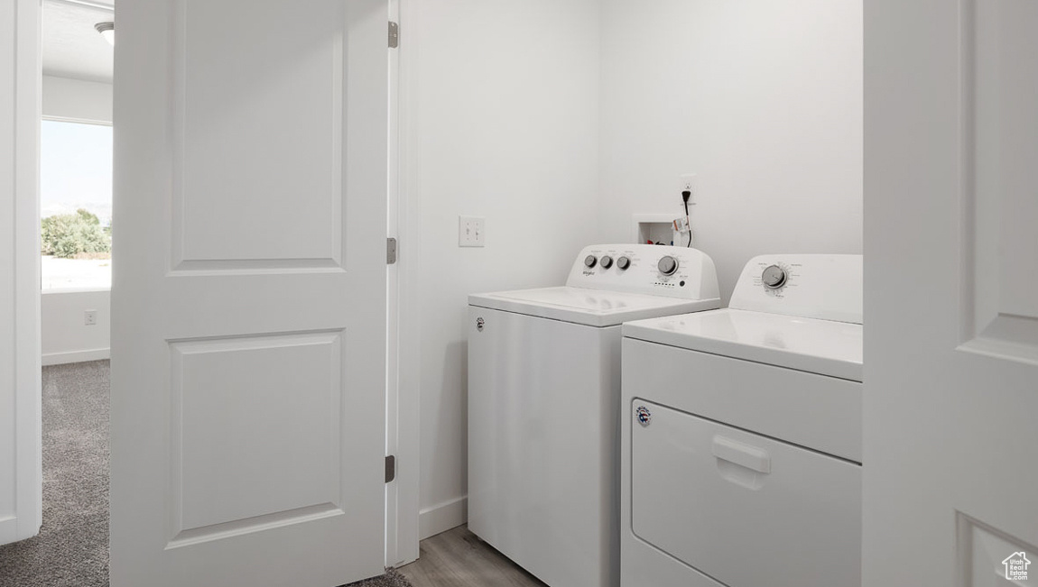 Laundry room featuring laundry area and washing machine and clothes dryer